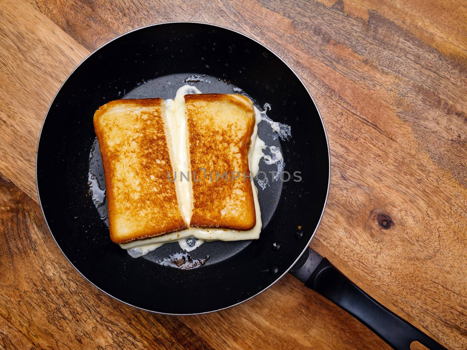 Grilled cheese sandwich on skillet by sumners