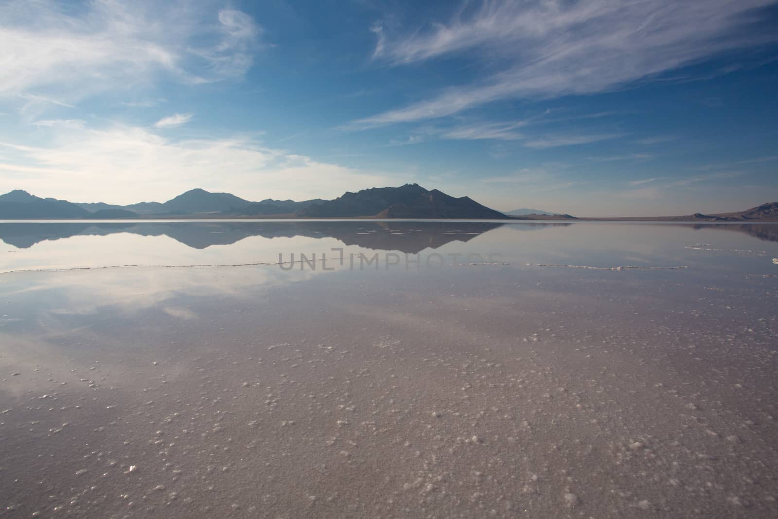 Bonneville Salt Flats International Speedway. Mystical reflection of desert mountains in sunset water