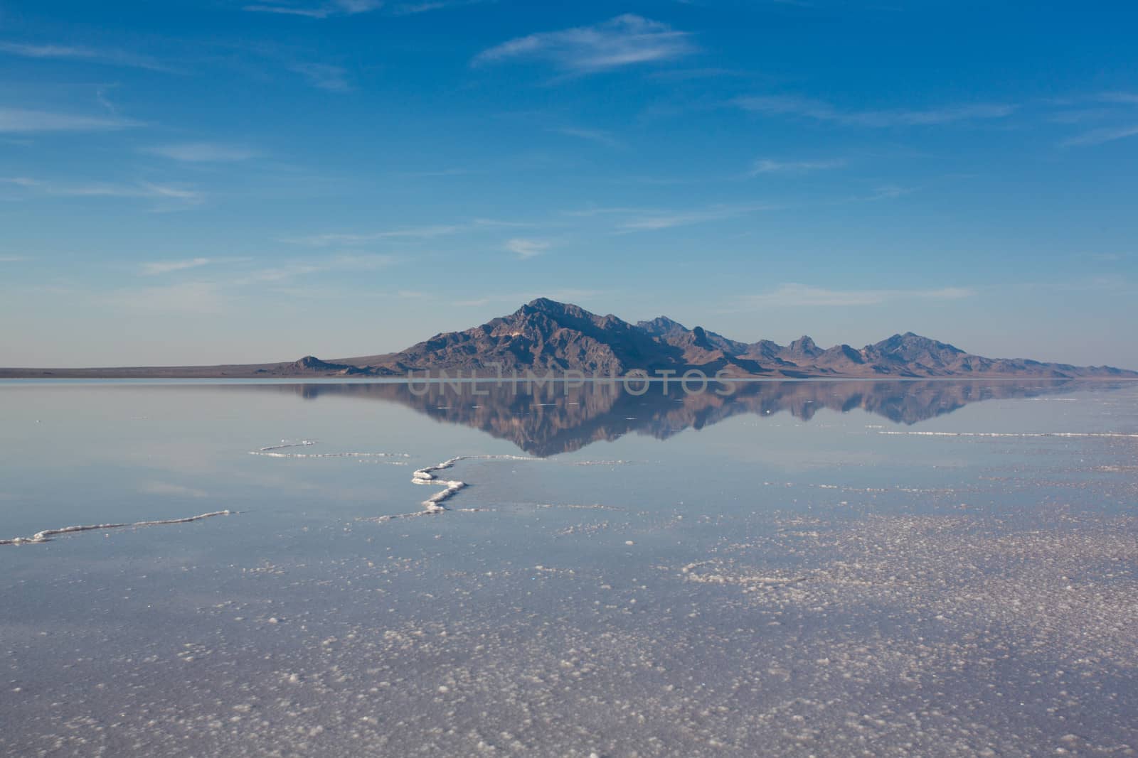 Bonneville Salt Flats International Speedway. Mystical reflection of desert mountains in sunset water