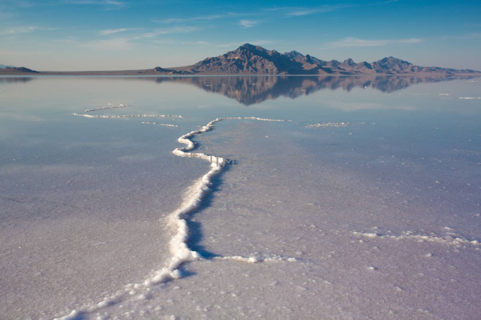 Bonneville Salt Flats International Speedway. Mystical reflection of desert mountains in sunset water