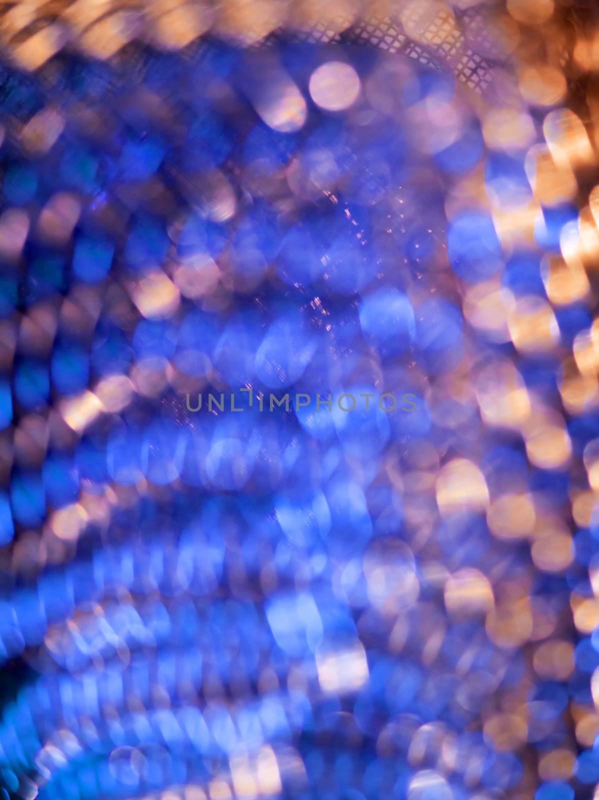 Abstract blurred background image of a microphone closeup.
