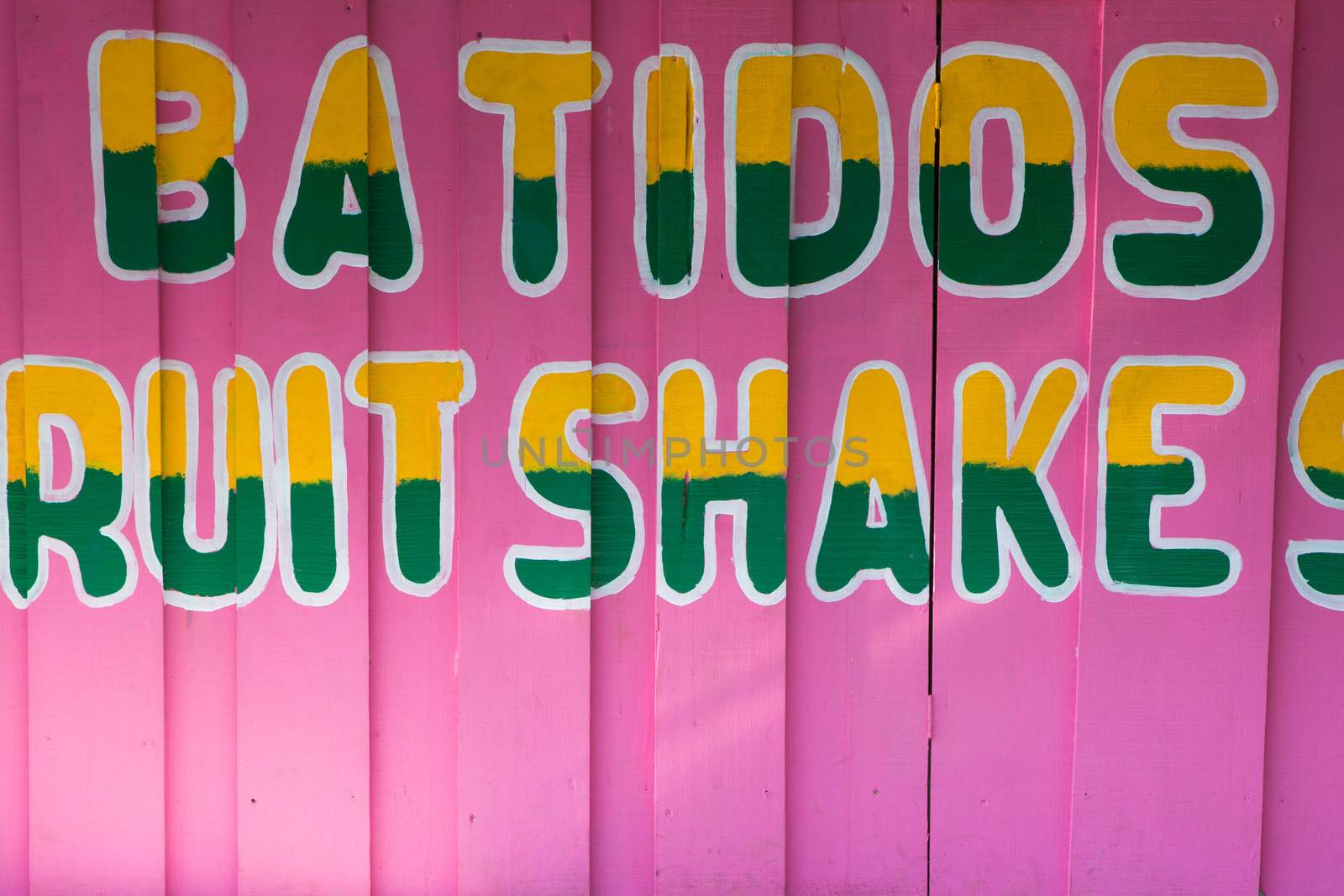 Colorful food sign painted on a wall, closeup in costa rica
