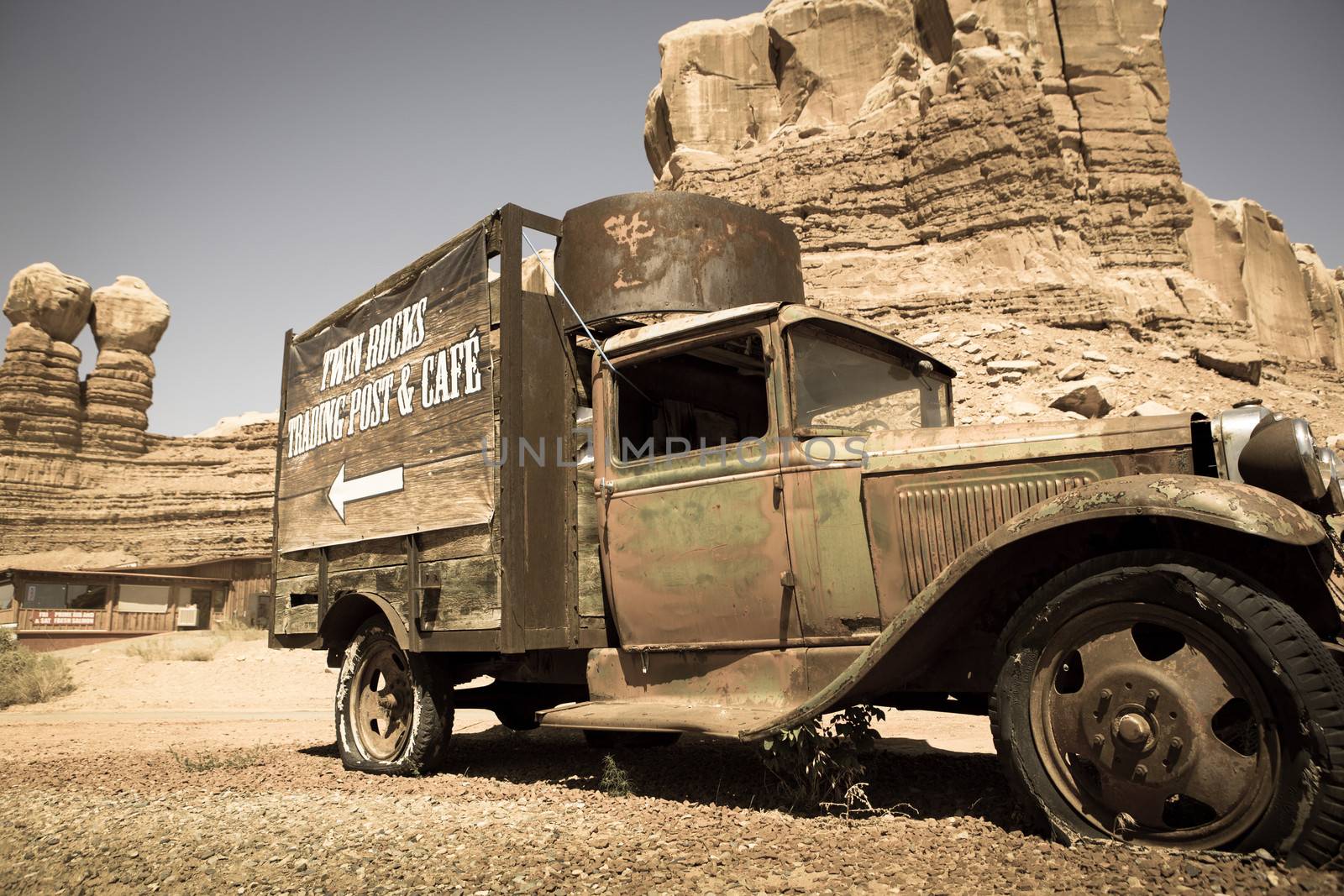 Old abandoned truck at the Twin rocks in the Utah, toned image