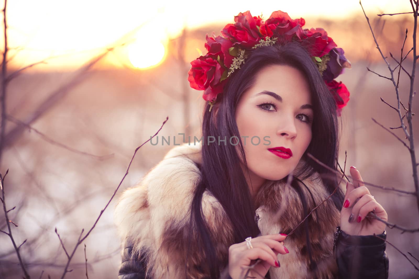 Young woman wearing flowers on her head lifestyle photo