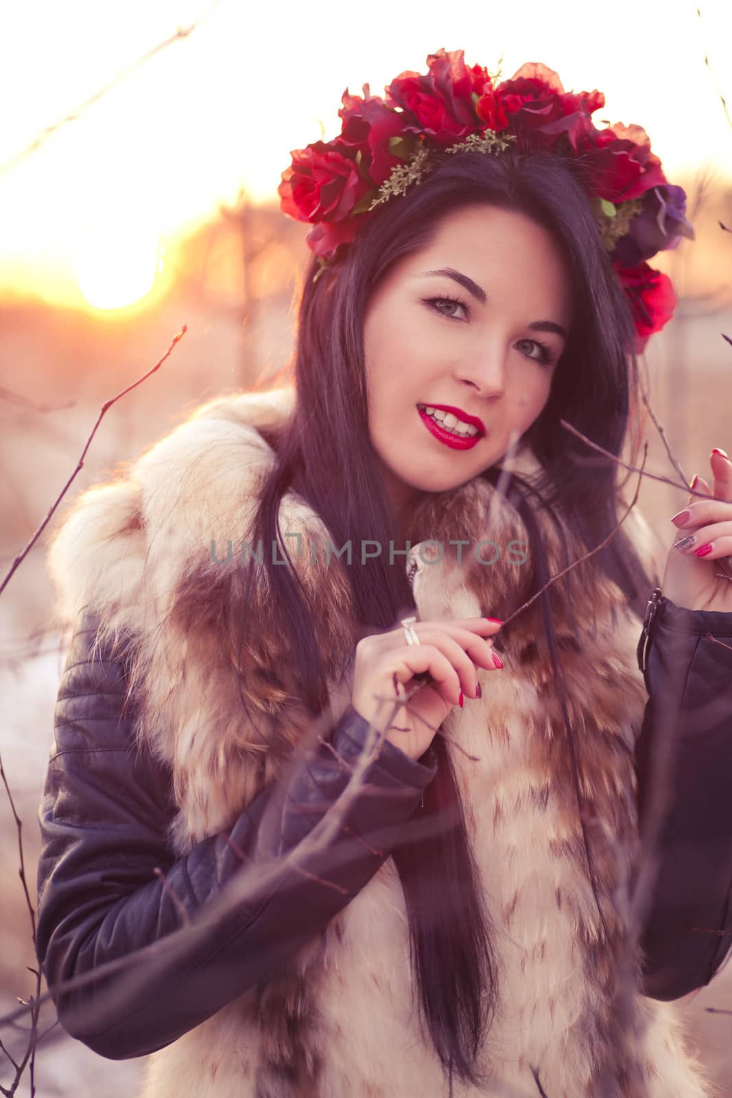 Young woman wearing flowers on her head lifestyle photo