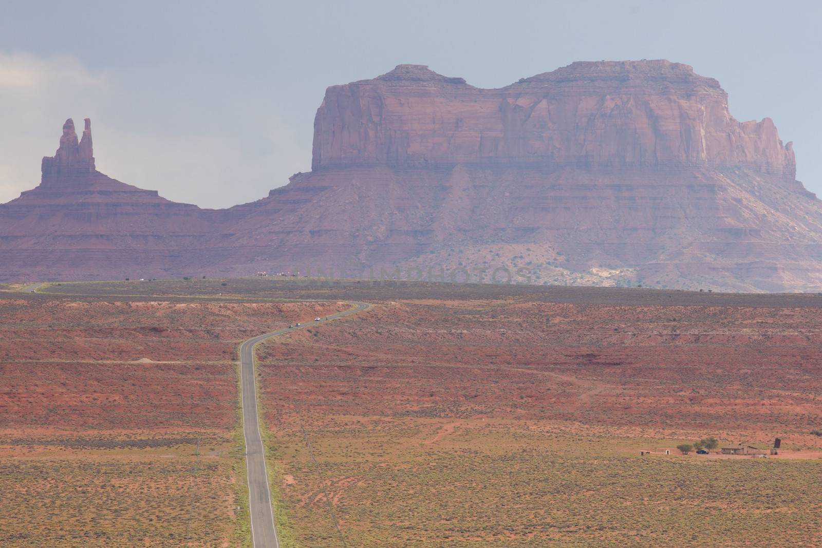 Empty road leading to Monument Valley with clear weather