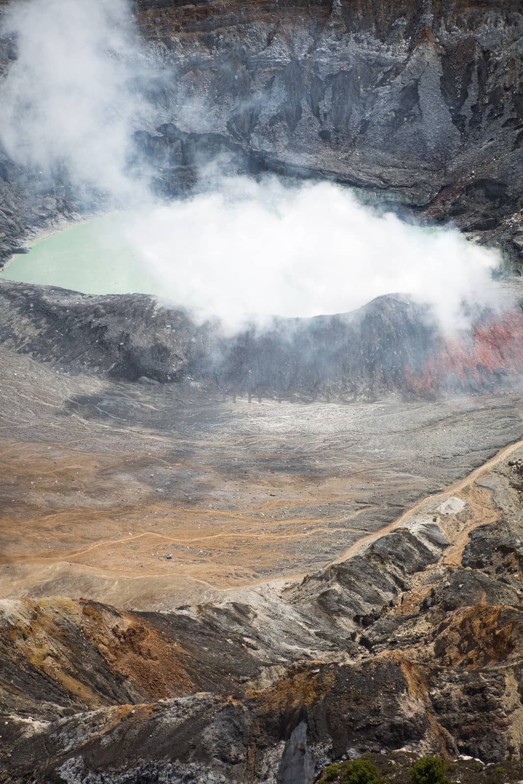 Fumarole smoke over the Poas Volcano in Costa Rica in 2012. Detail of the acid water crater with turquoise colors.