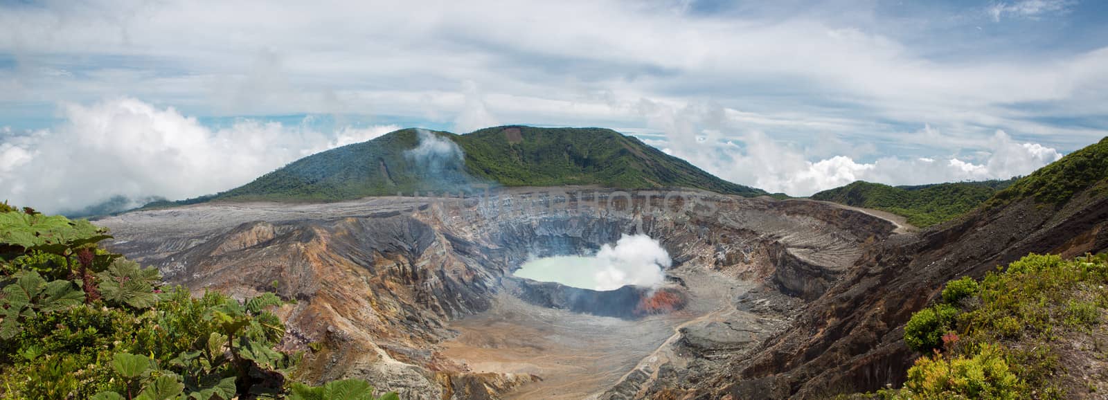 Panoramic view of  fumarole smoke over the Poas Volcano in Costa Rica in 2012. Detail of the acid water crater with turquoise colors.