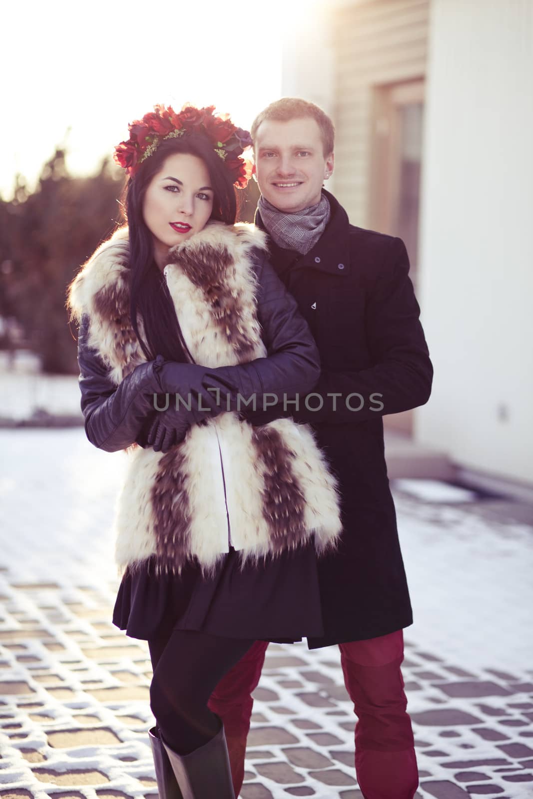 Stylish couple having a walk in the city in winter
