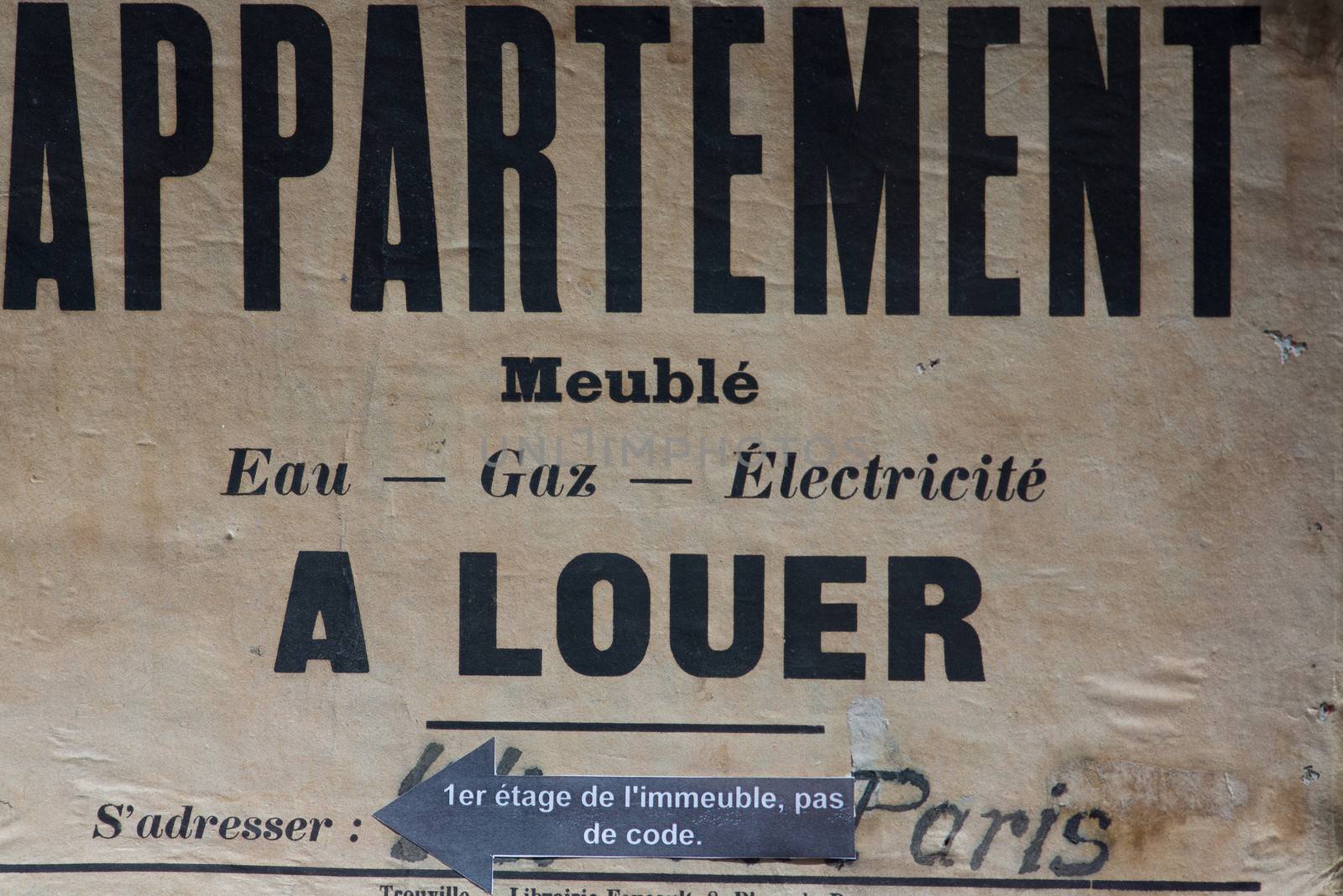 Vintage eal estate sign for rent apartment in Paris, France