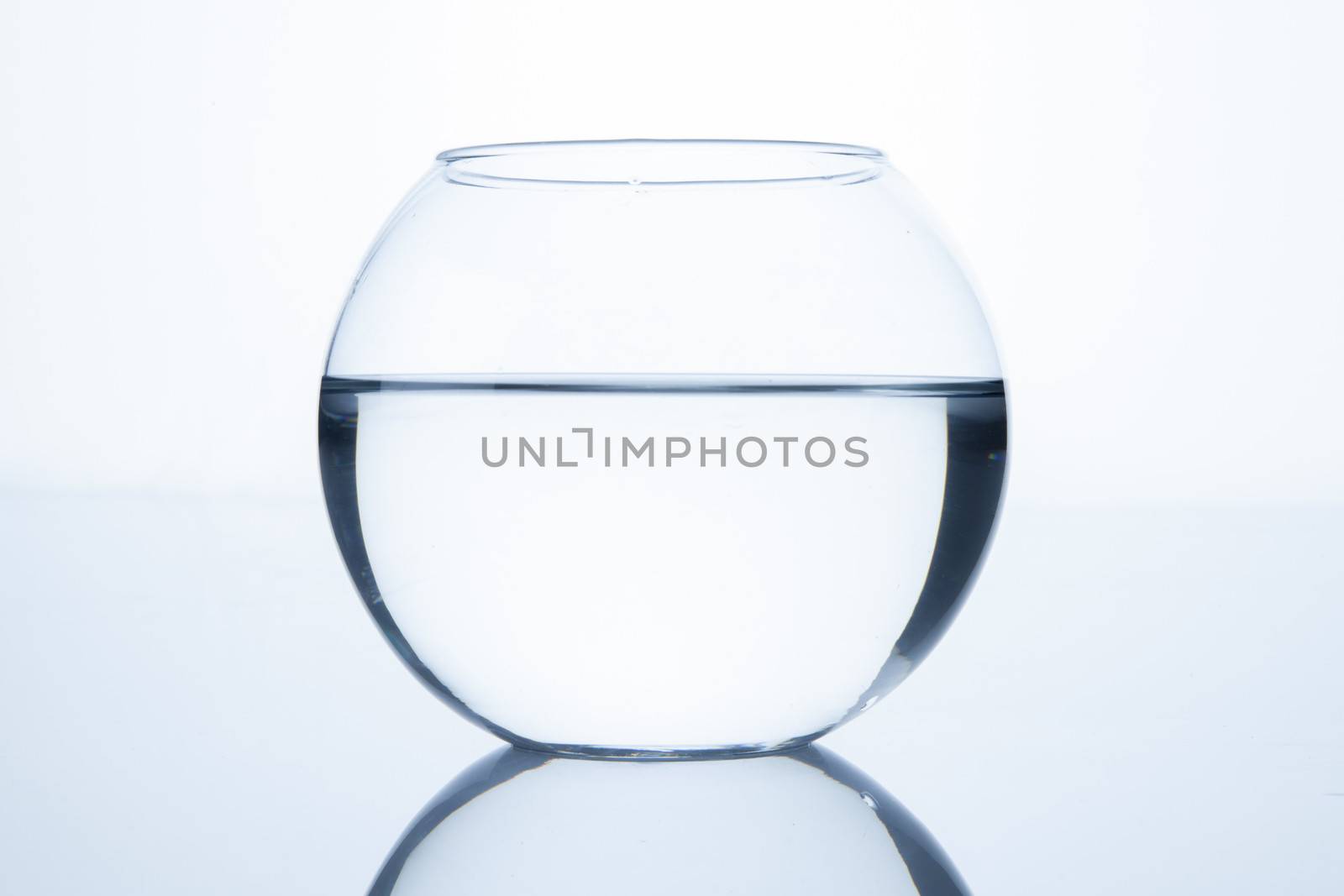 Empty fish bowl with water by haiderazim