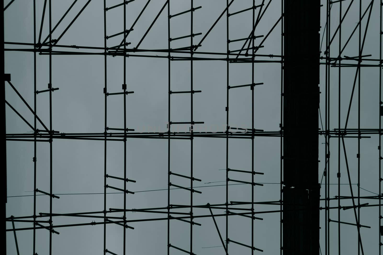 Close up of scarfolder on a construction site taken. Toned colours, blue and black.