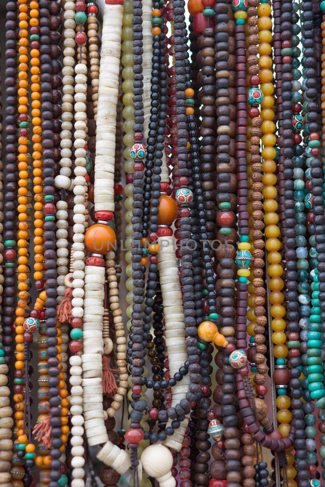 Prayer chains in a local shop  by watchtheworld