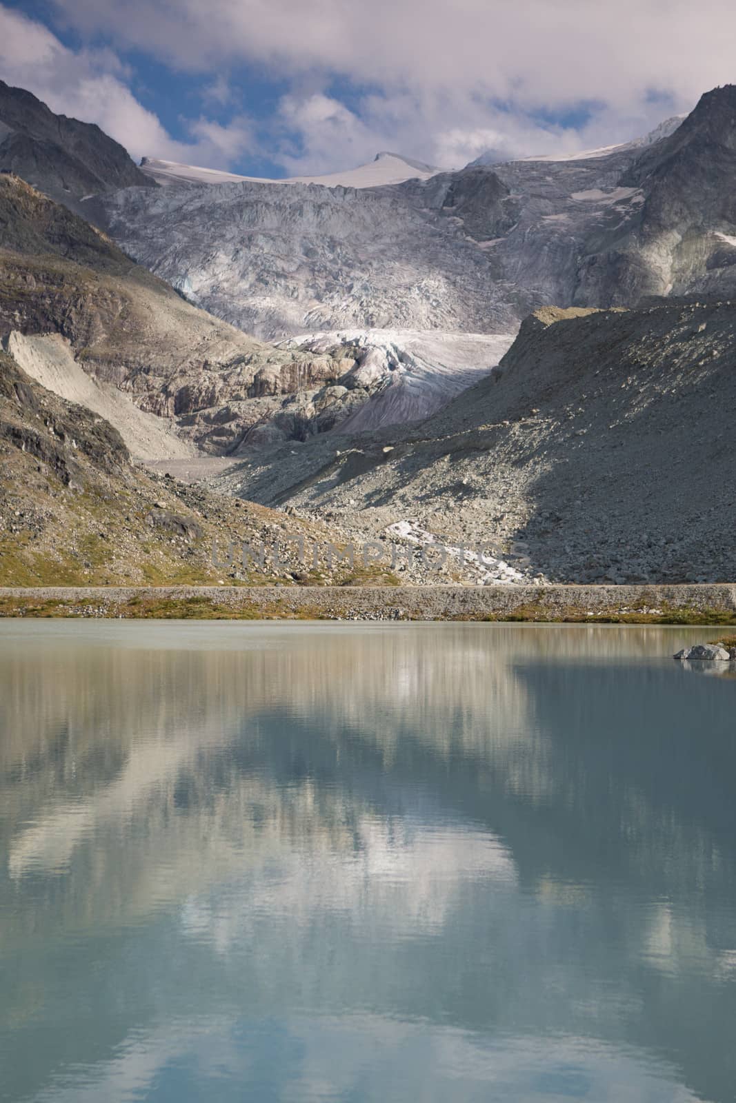 Mountain lake Moiry in the Valais by watchtheworld