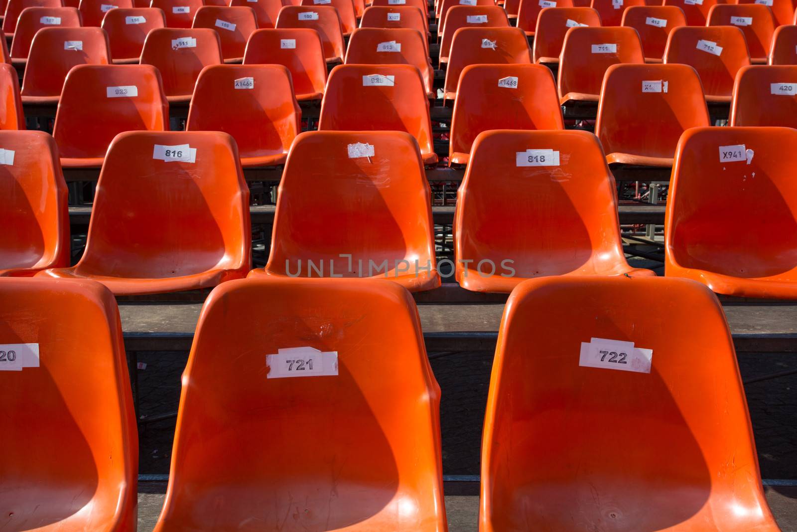 Orange Seats with numbers by watchtheworld