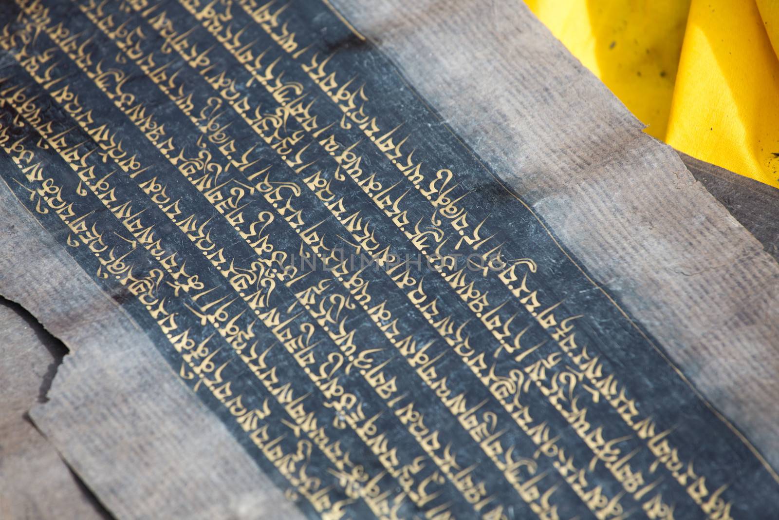 Close up of an old Tibetan manuscript. The kings’ minister Thonmi Sambhota developed the Tibetan script to accommodate the influx of the Buddha’s teachings, Sutra and Tantra manuscripts from India.