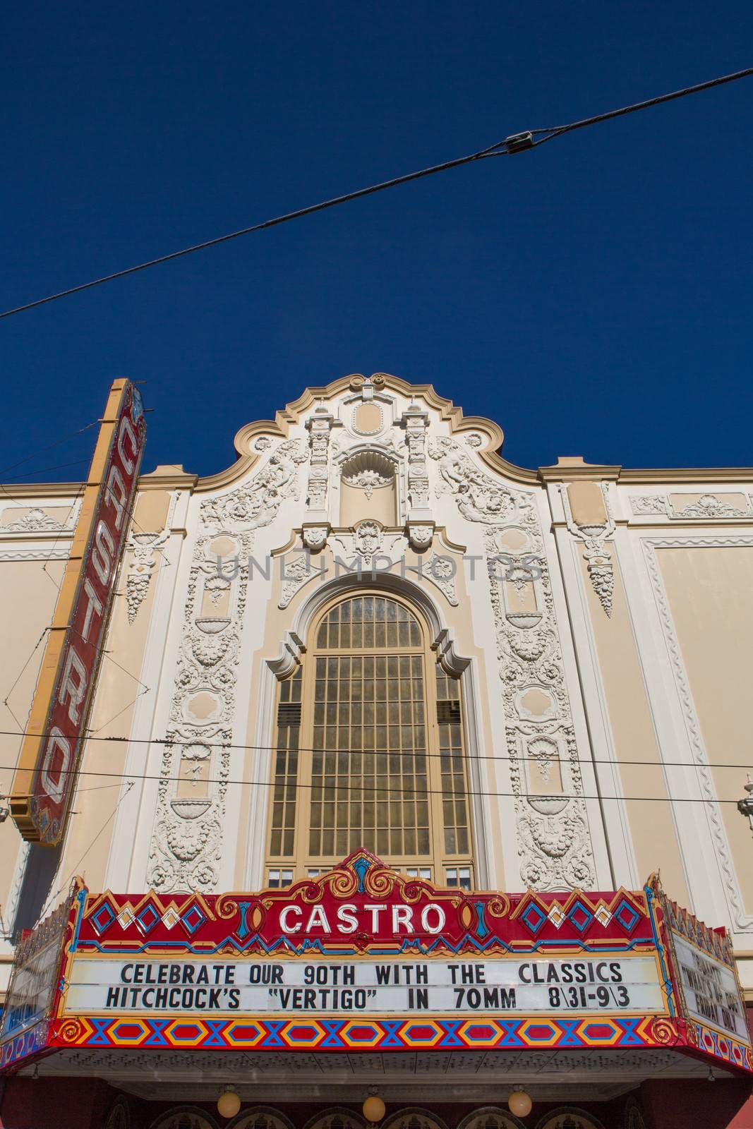 Front view of the Castro Theater in San Francisco against a blue sky.