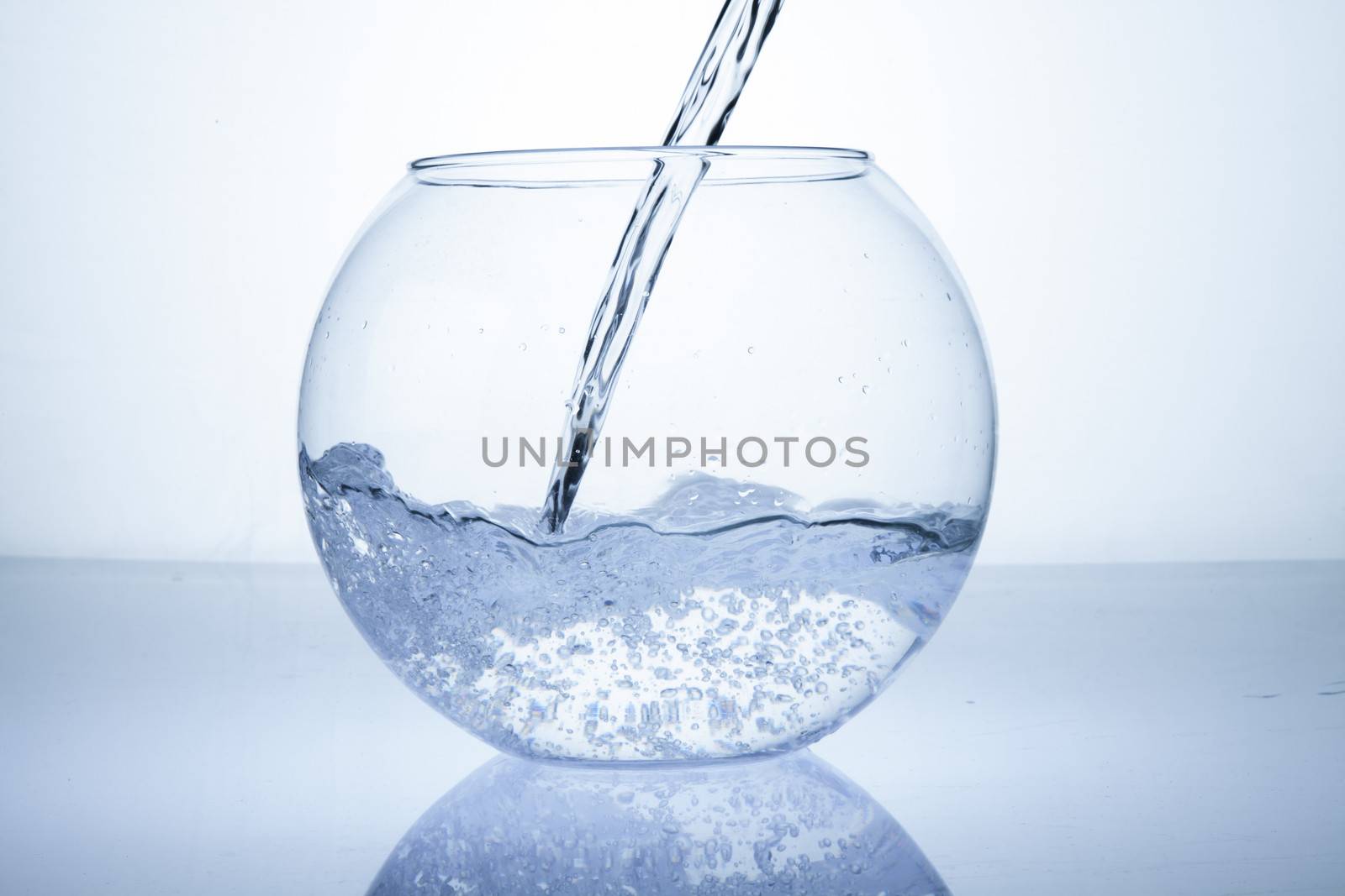 Water being poured in an empty bowl by haiderazim