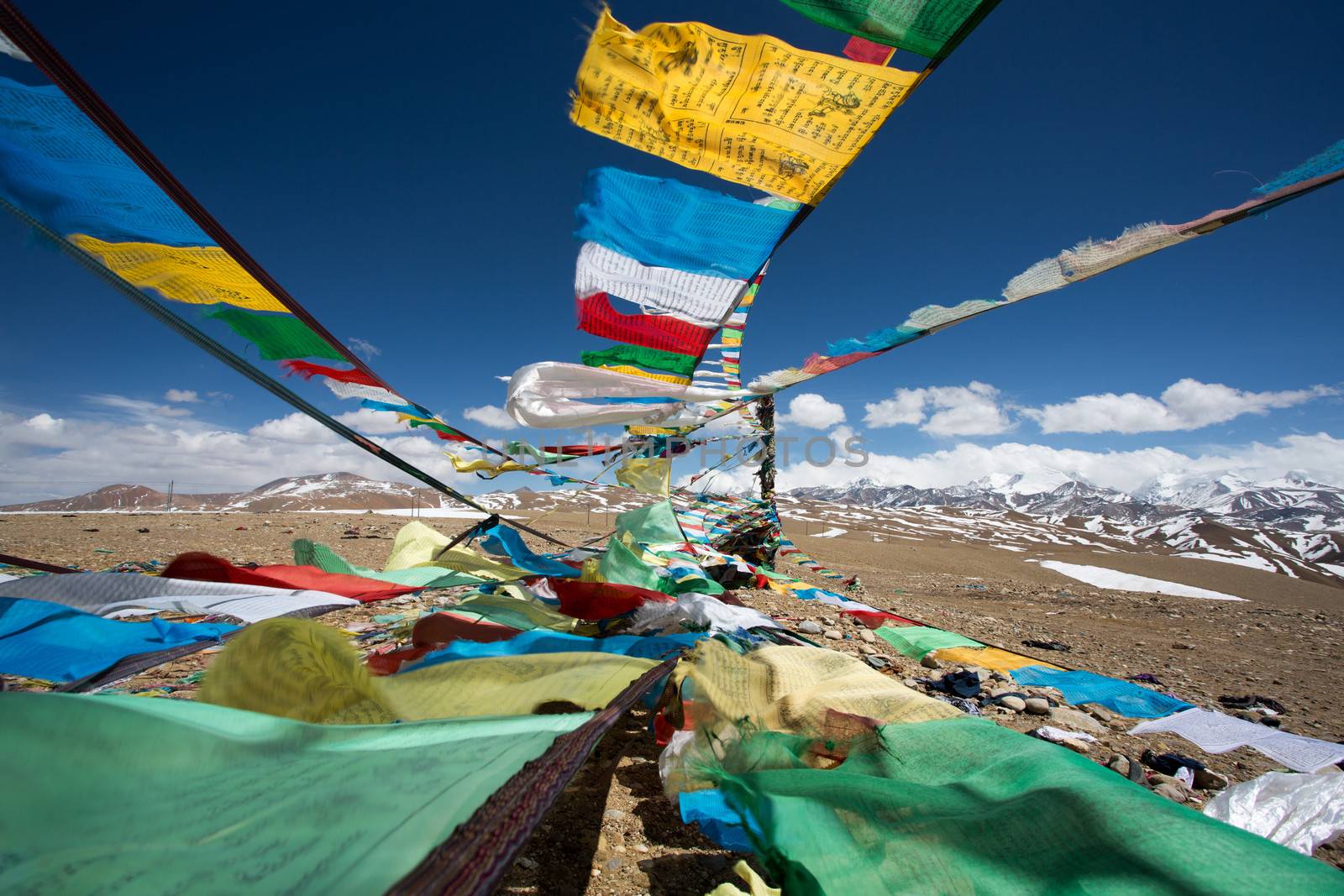 Prayer Flags and the range of Himalaya Mountains in in the background, on the Friendship Highway in Tibet