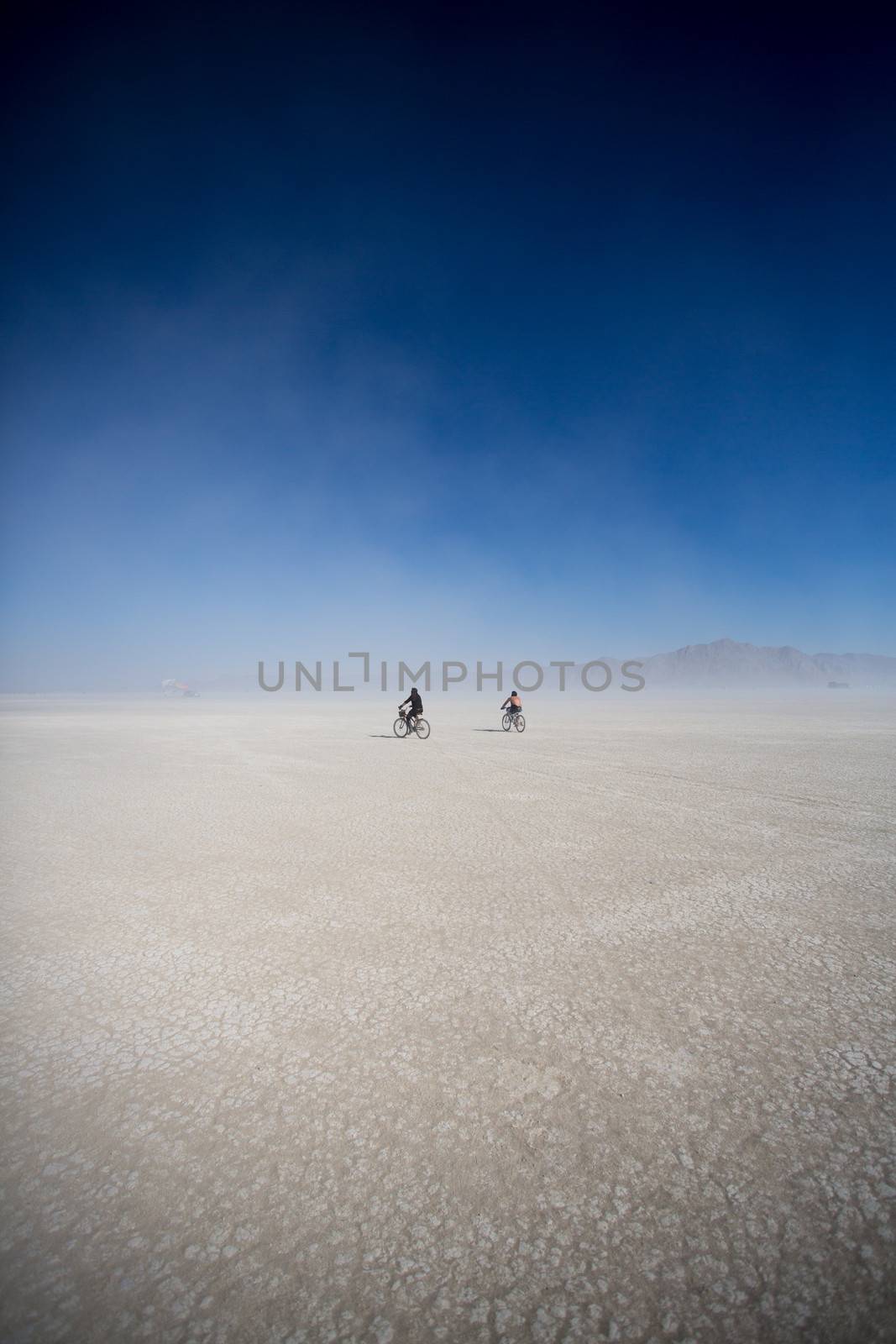 Cyclists riding mountain bikes in the Black Rock Desert in Nevada, USA