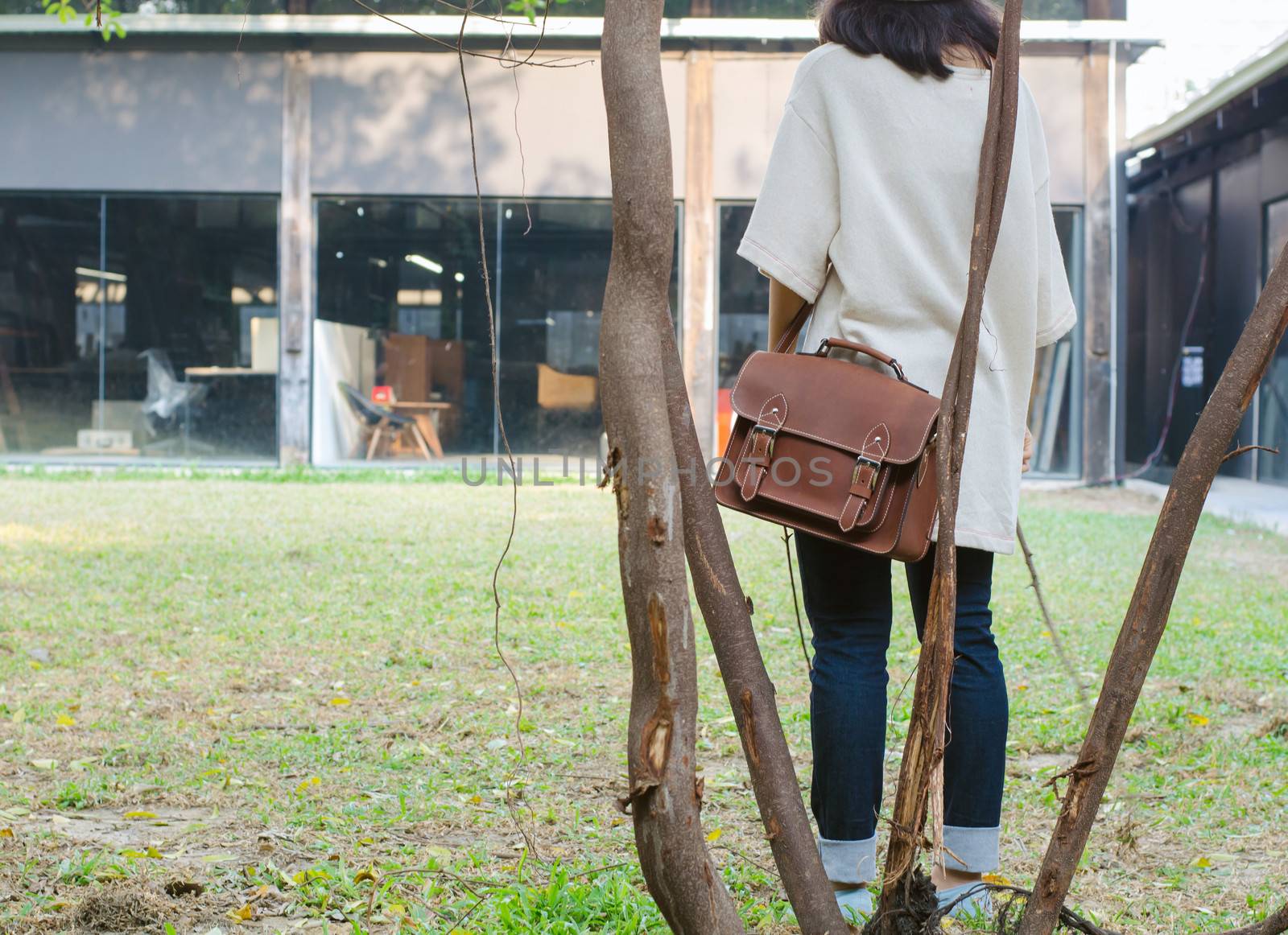 Fashion woman with vintage leather bag