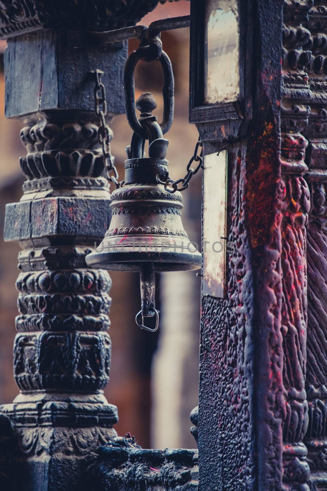 Traditional Nepalese bell in a very old and small temple in Nepa by watchtheworld