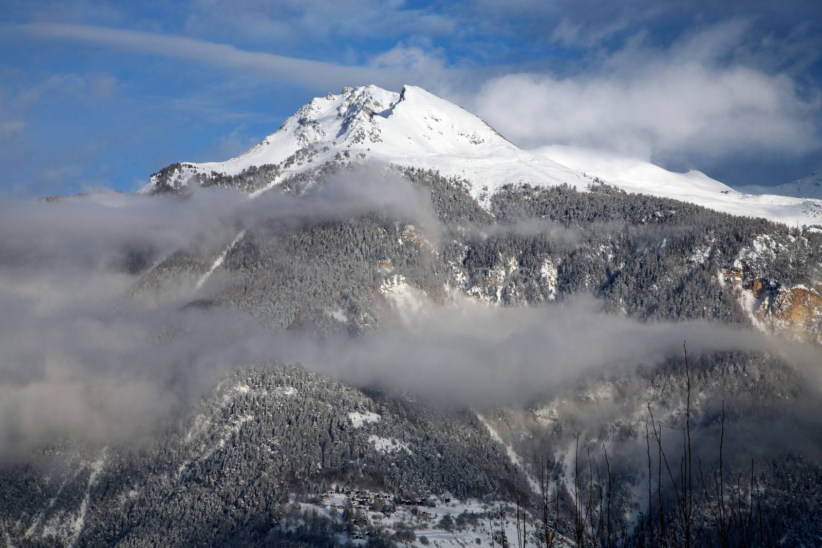 Cloudy montain in Crans-Montana by watchtheworld