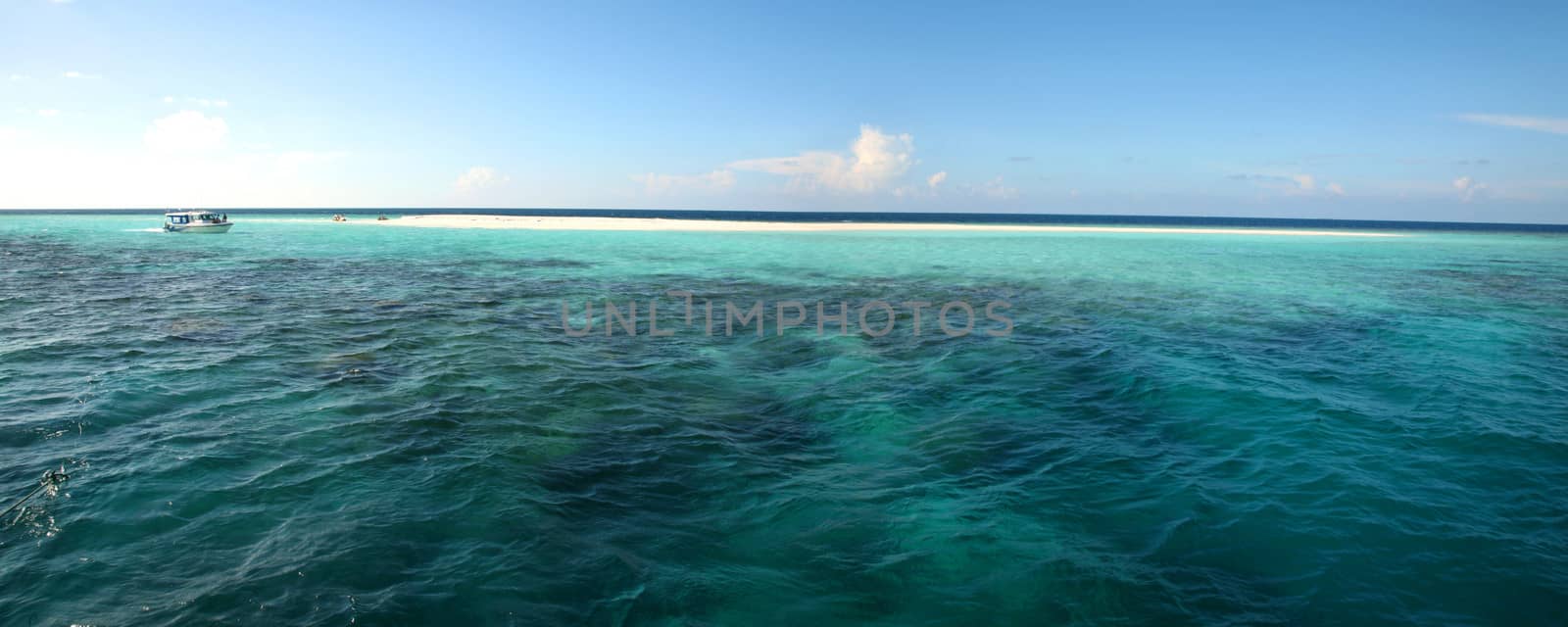 Detail of the Indian Ocean in the Maldives, blue sky and crystal water, Maldives.