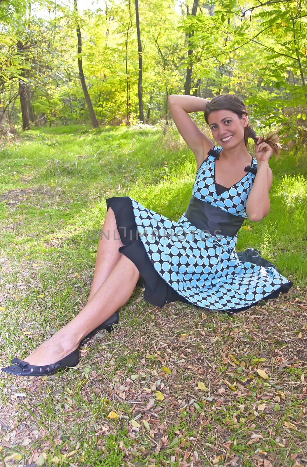 young pretty woman in forest in spring time