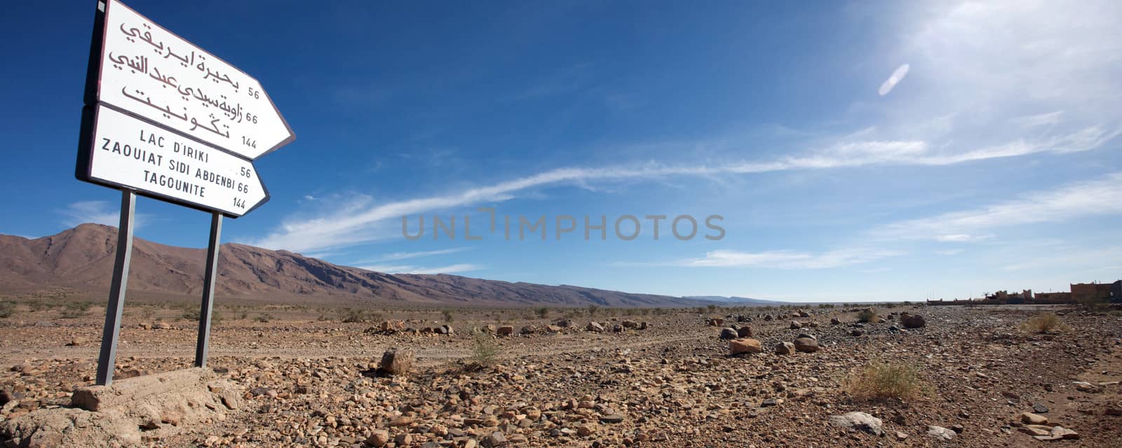 Road Sign to Tagounite in Morocco with blue sky.