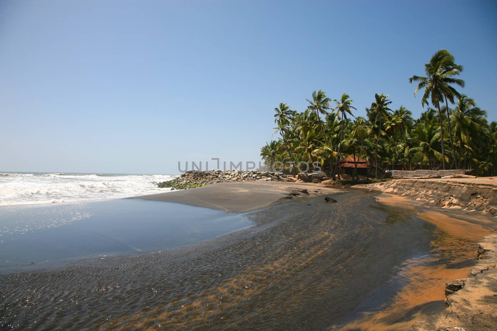 Blue sky and Varkala black beach, in Kerala, India.