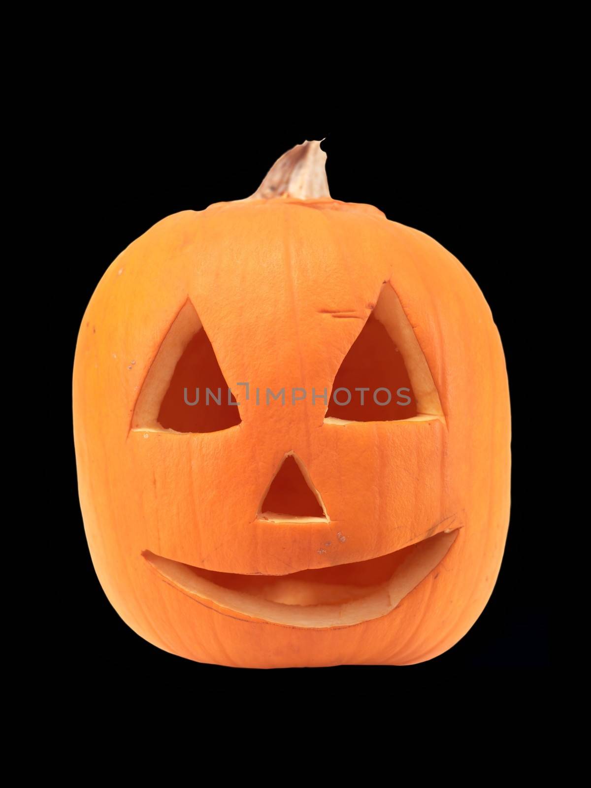 A close up shot of a halloween pumpkin