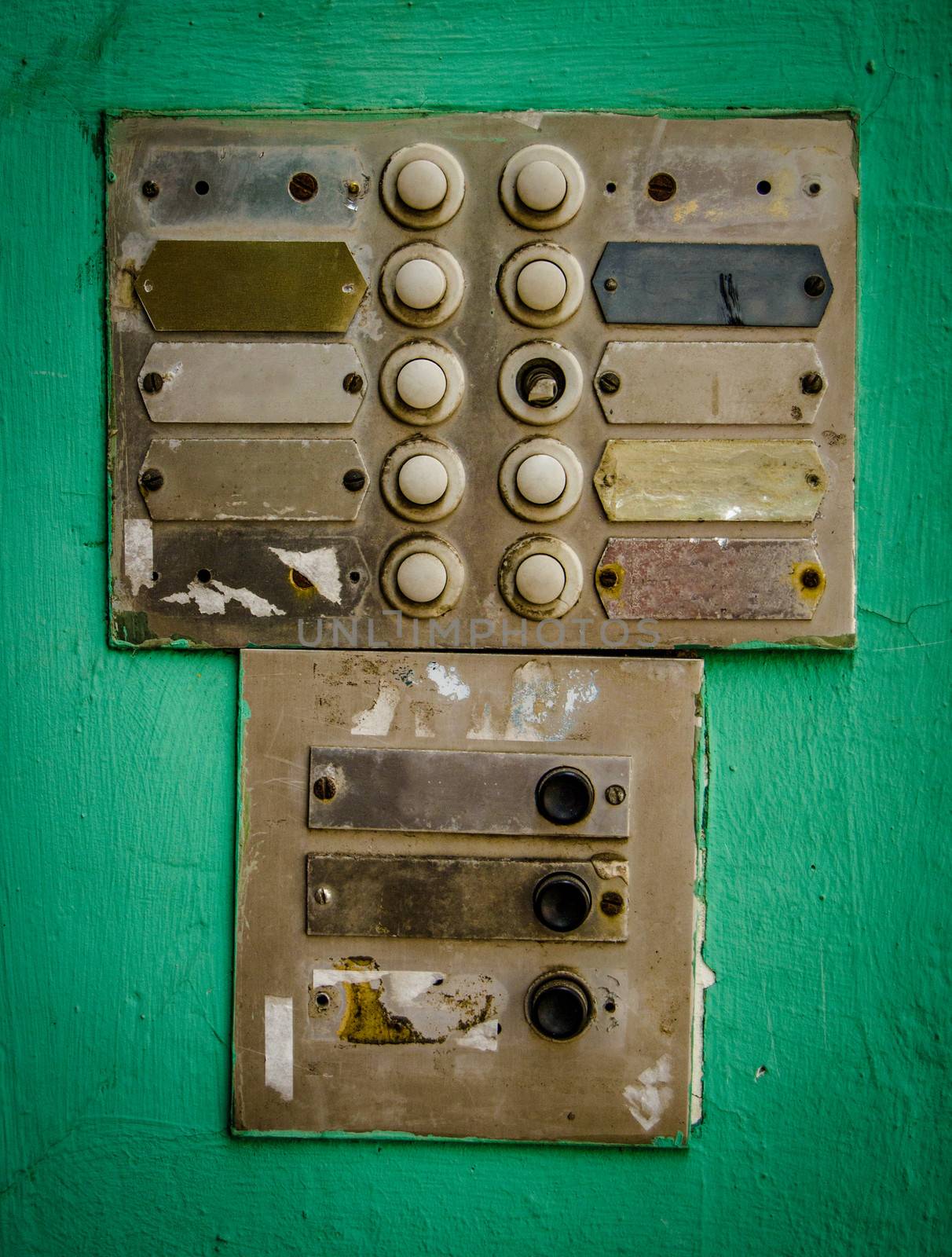 Rustic Old Apartment Intercom Buzzer Agaist Green Painted Wall