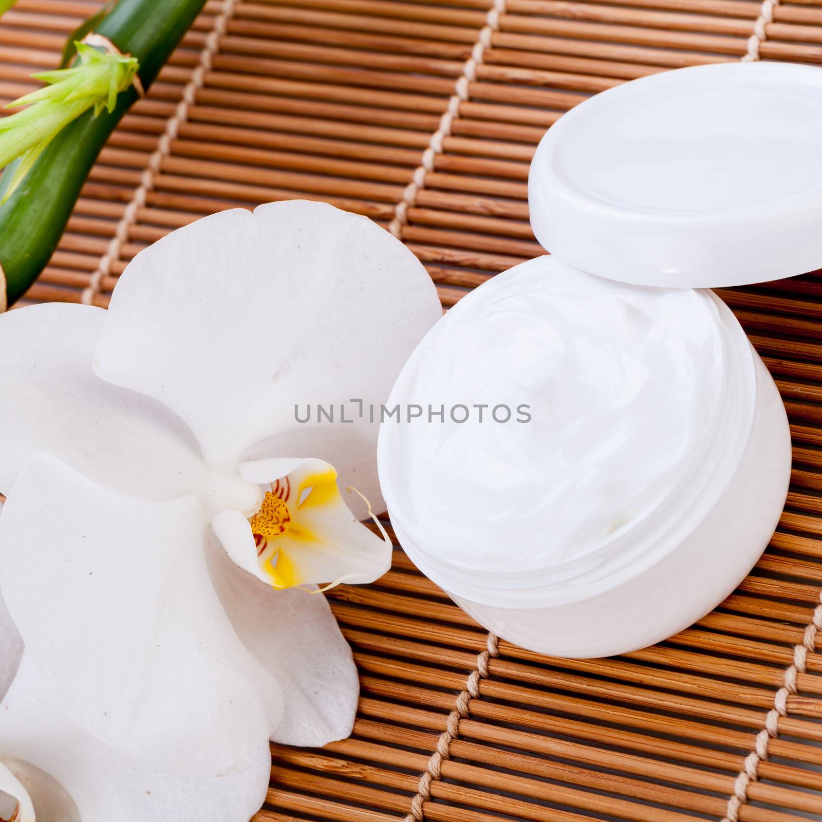 cosmetic face cream on wooden background object flower beauty