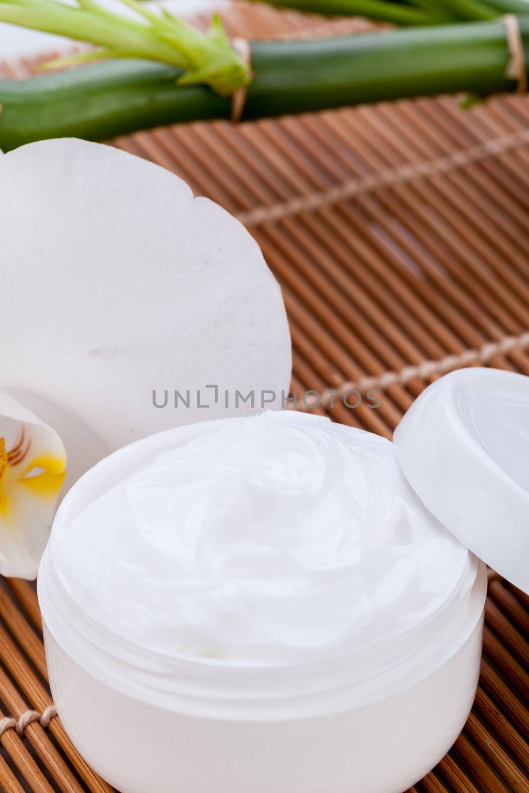 cosmetic face cream on wooden background  by juniart