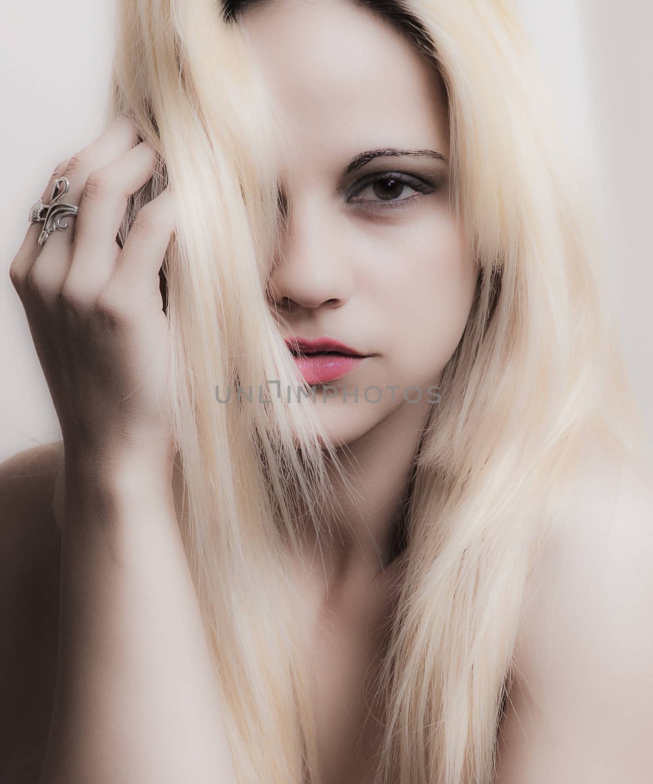 beautiful blond woman with hair over face
