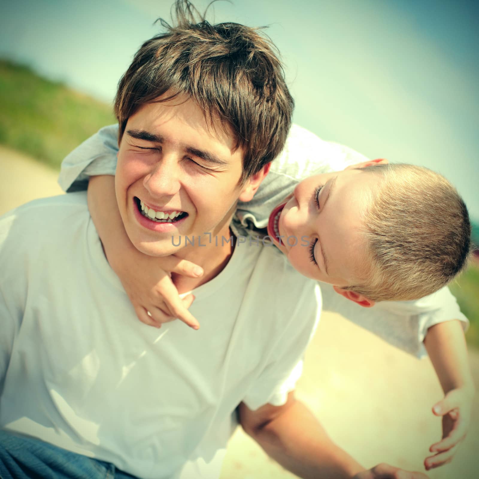 Vintage photo of Happy Teenager and Kid outdoor