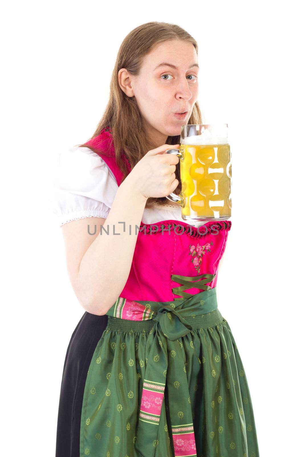 Woman in dirndl drinking delicious beer at oktoberfest by gwolters