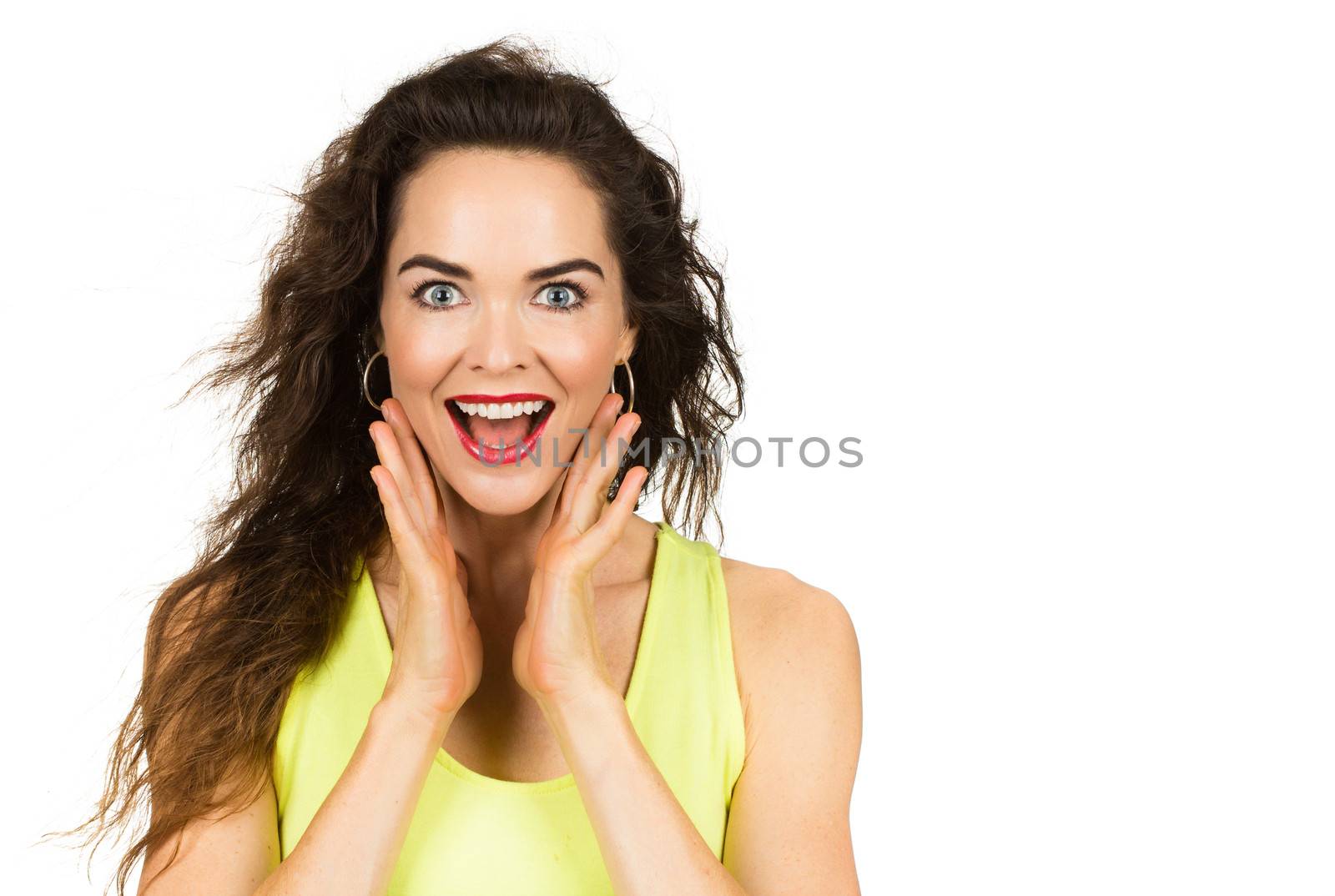 A happy and surprised beautiful woman looking at camera. Isolated on white.