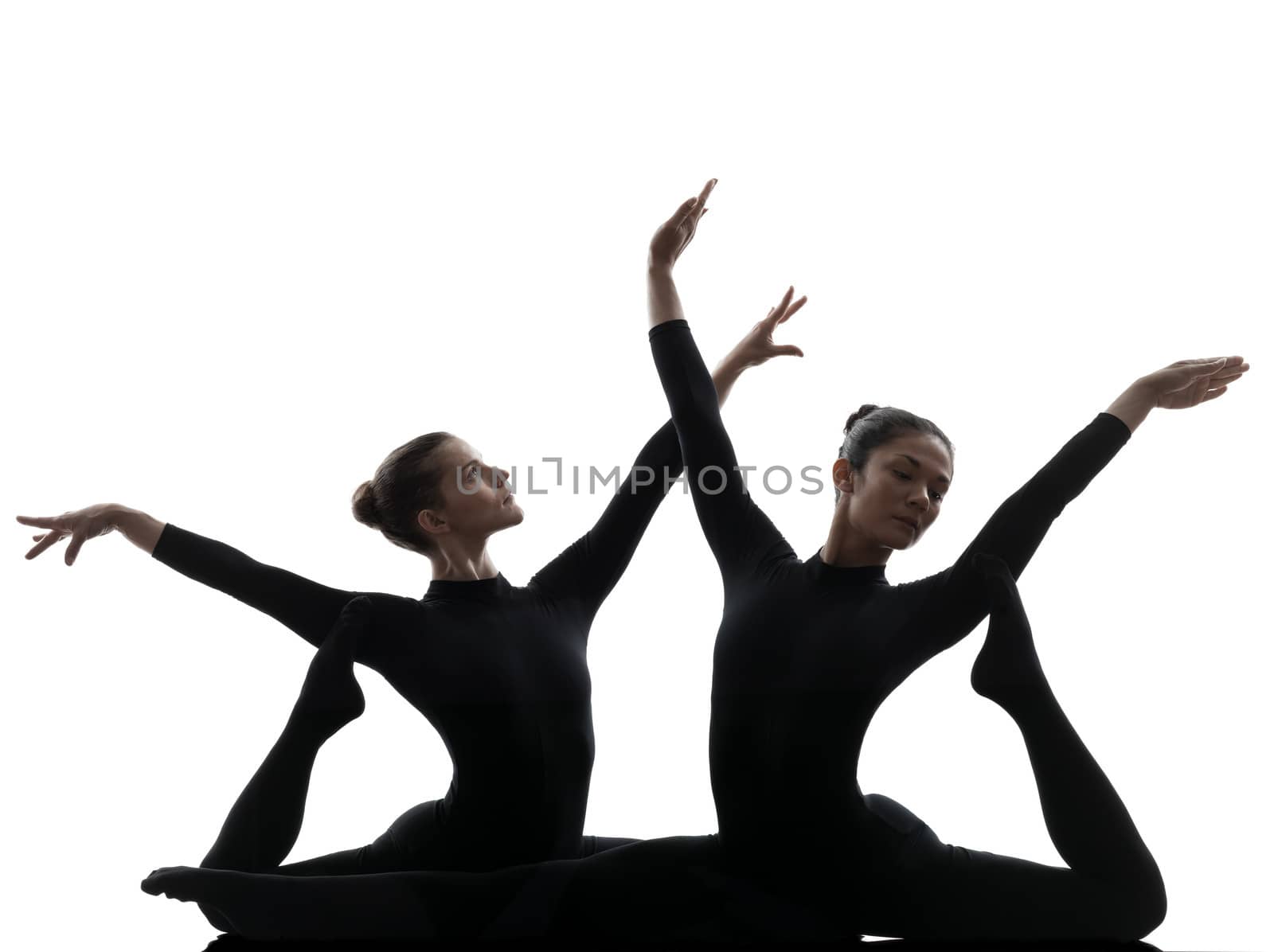 two women contortionist  exercising gymnastic yoga silhouette by PIXSTILL