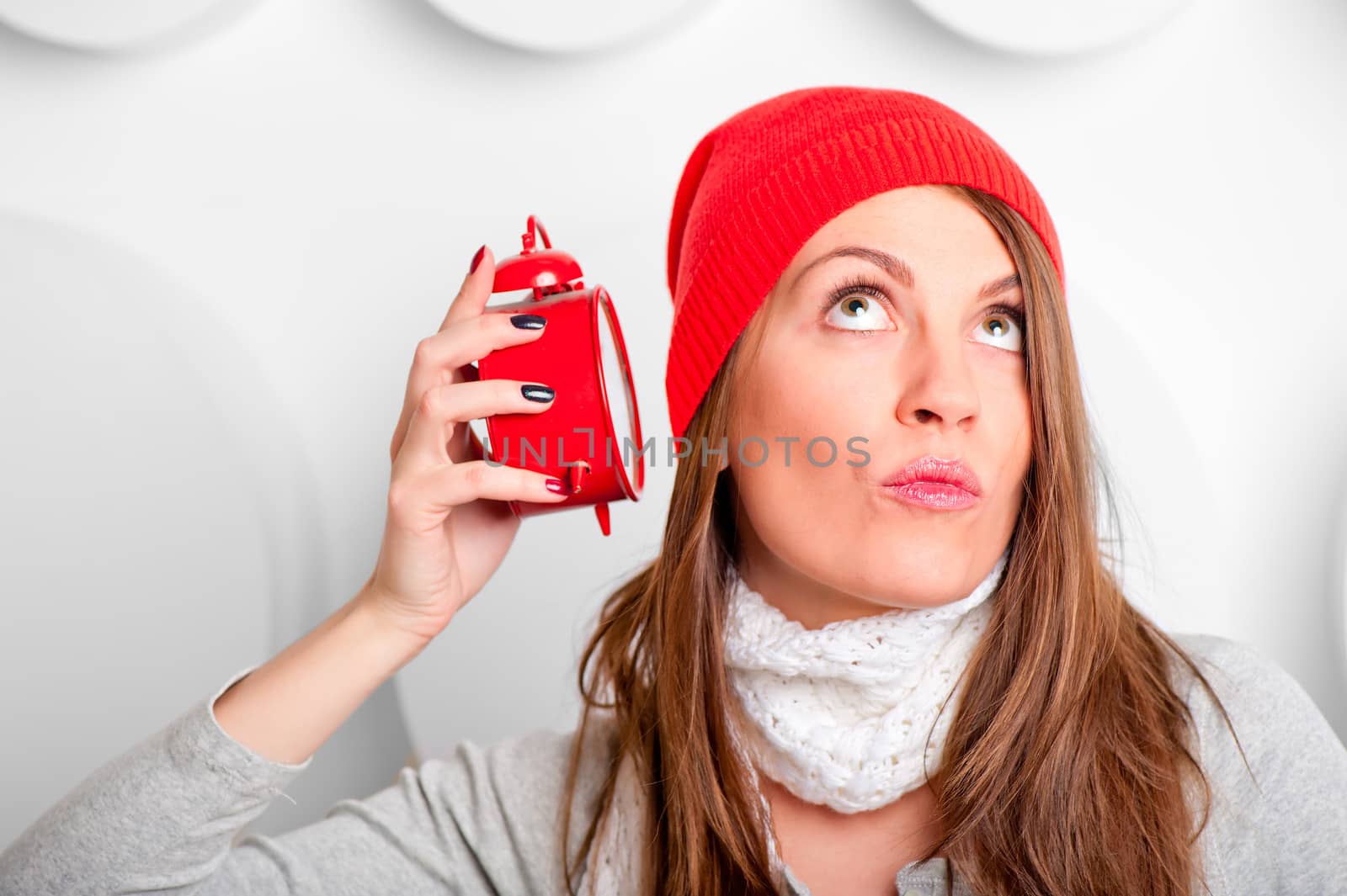 beautiful brunette in a red hat listening alarm clock by kosmsos111