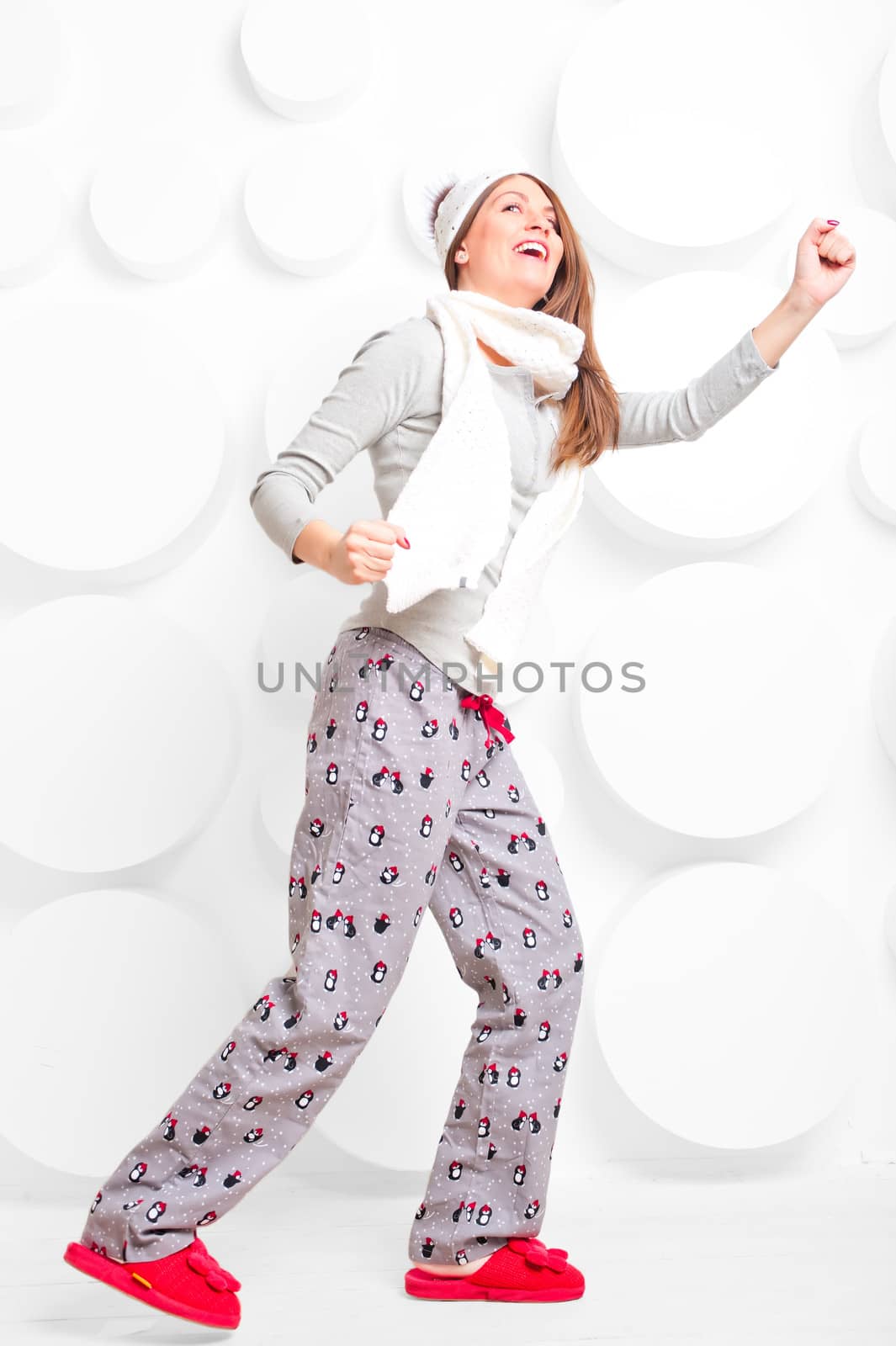 beautiful girl in pajamas shows skier by kosmsos111