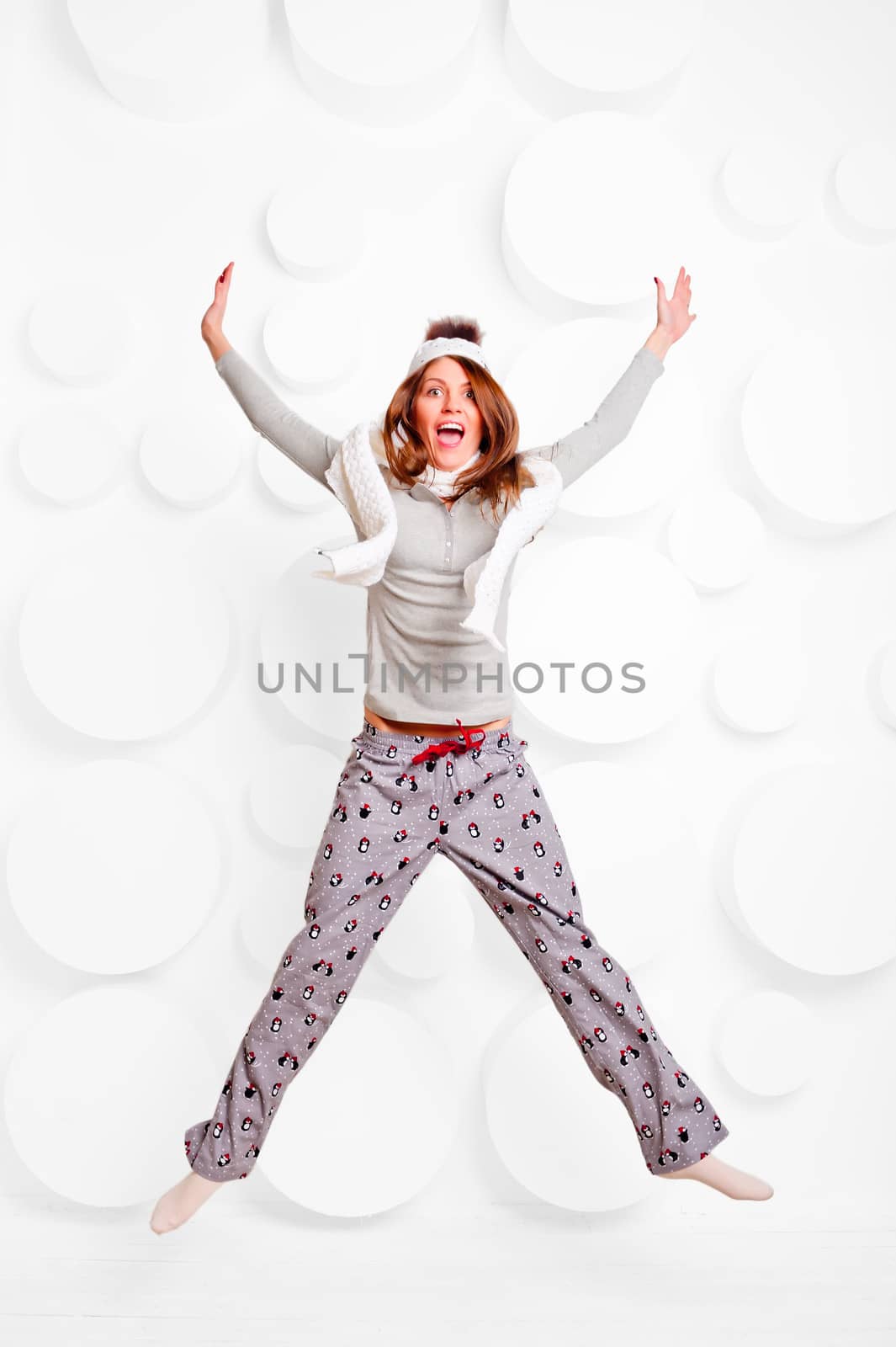 girl jumping in the studio in pajamas