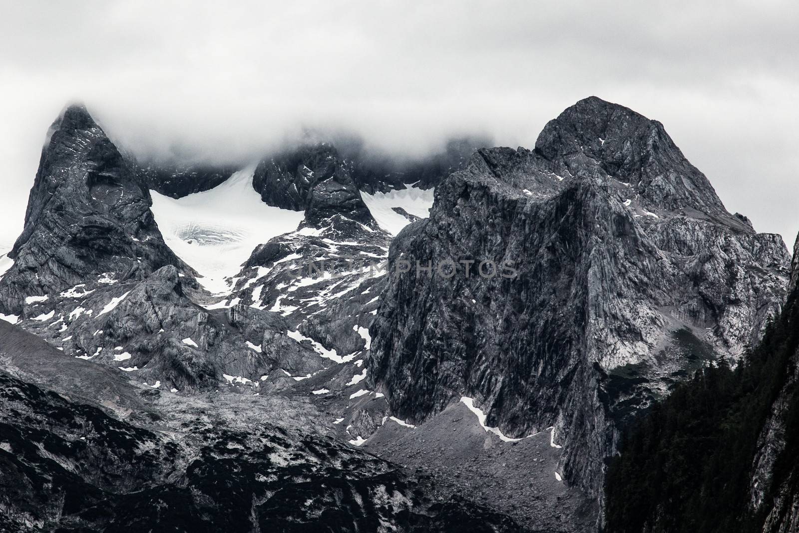 Huge rock in Alps mountains b&w view