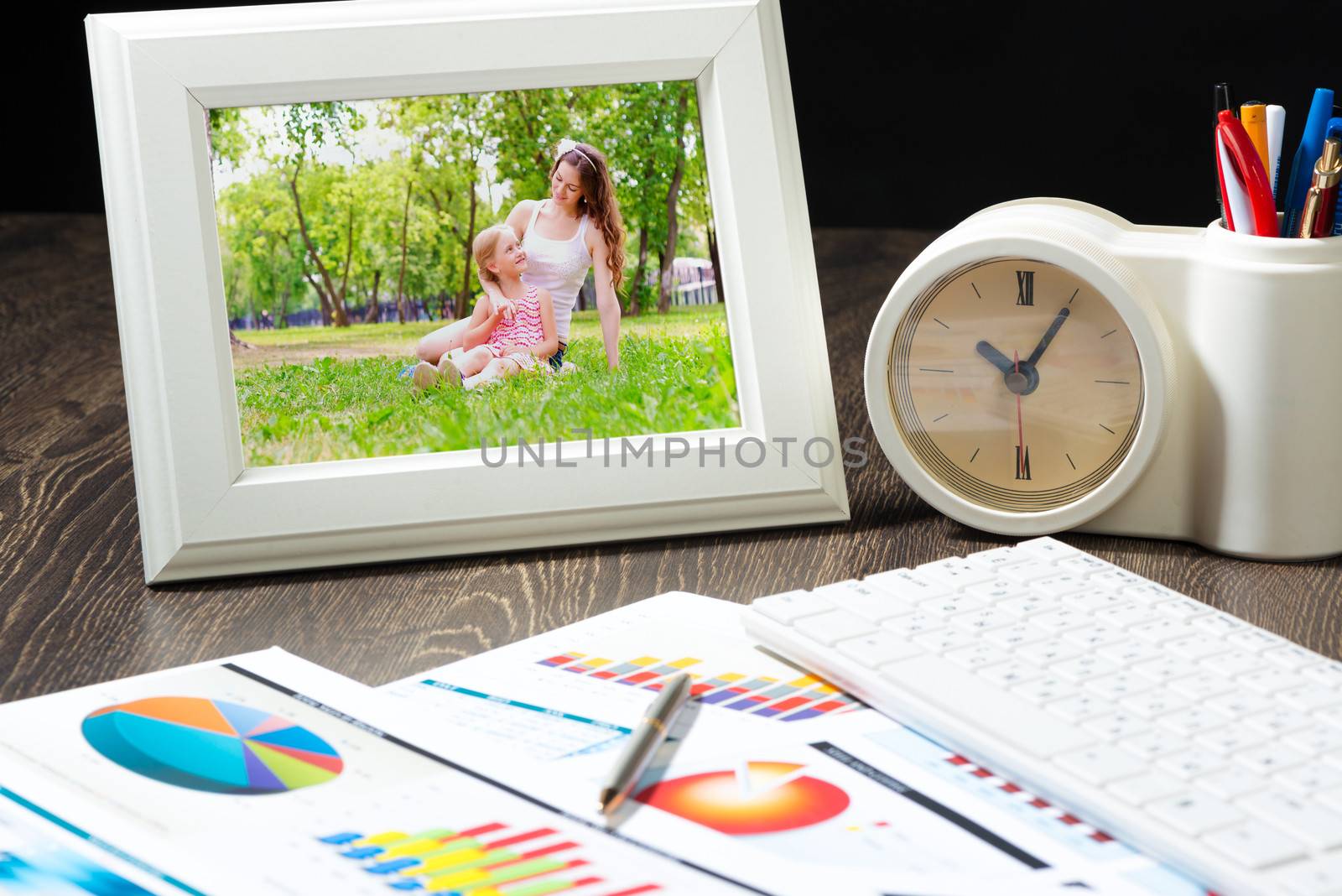 photo frame, keyboard and business paper. Workplace of the businessman.