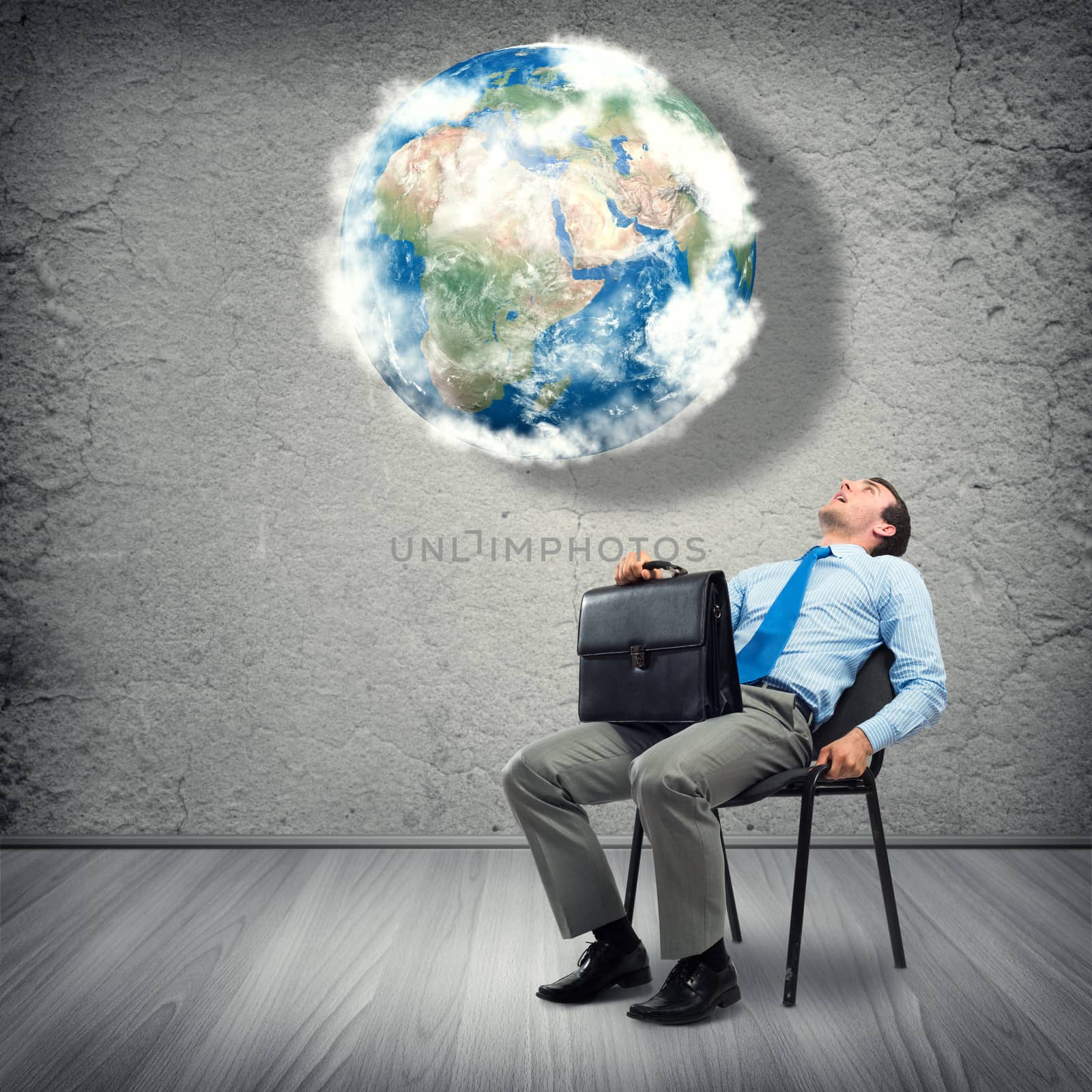 image of a business man looking at the planet. Elements of this image furnished by NASA