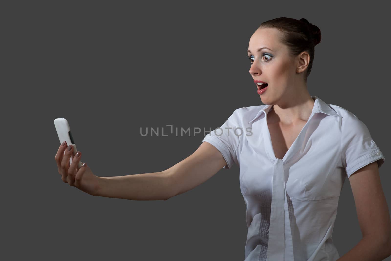 image of young business woman holding a cell phone