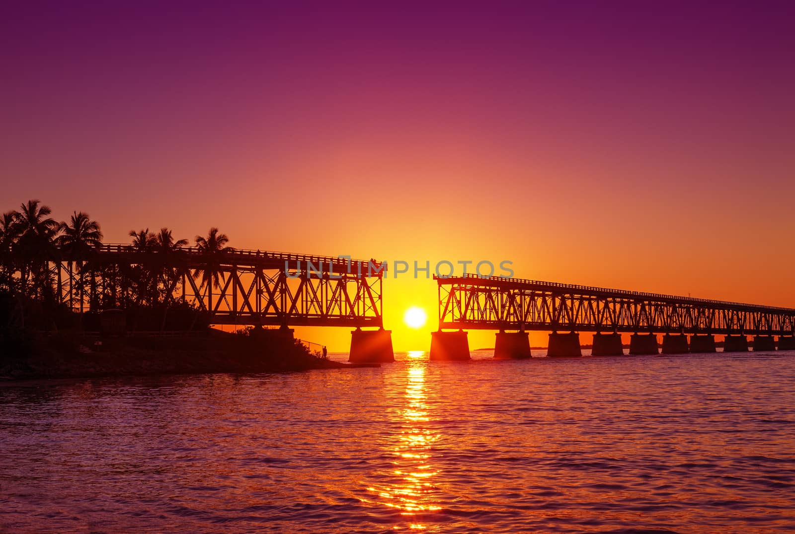 Colorful sunset or sunrise with broken bridge
