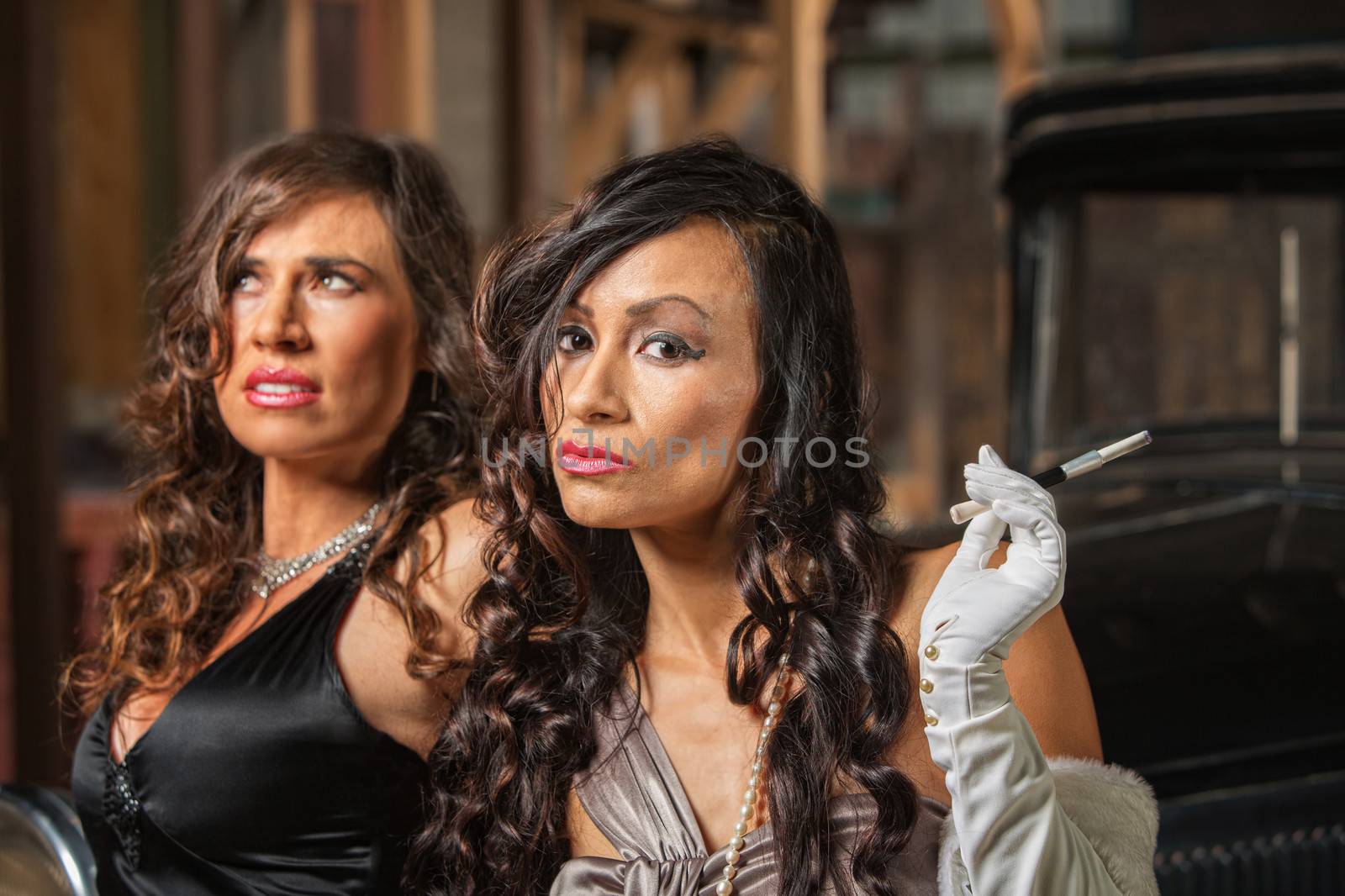 Two beautiful Latino women in retro style dresses