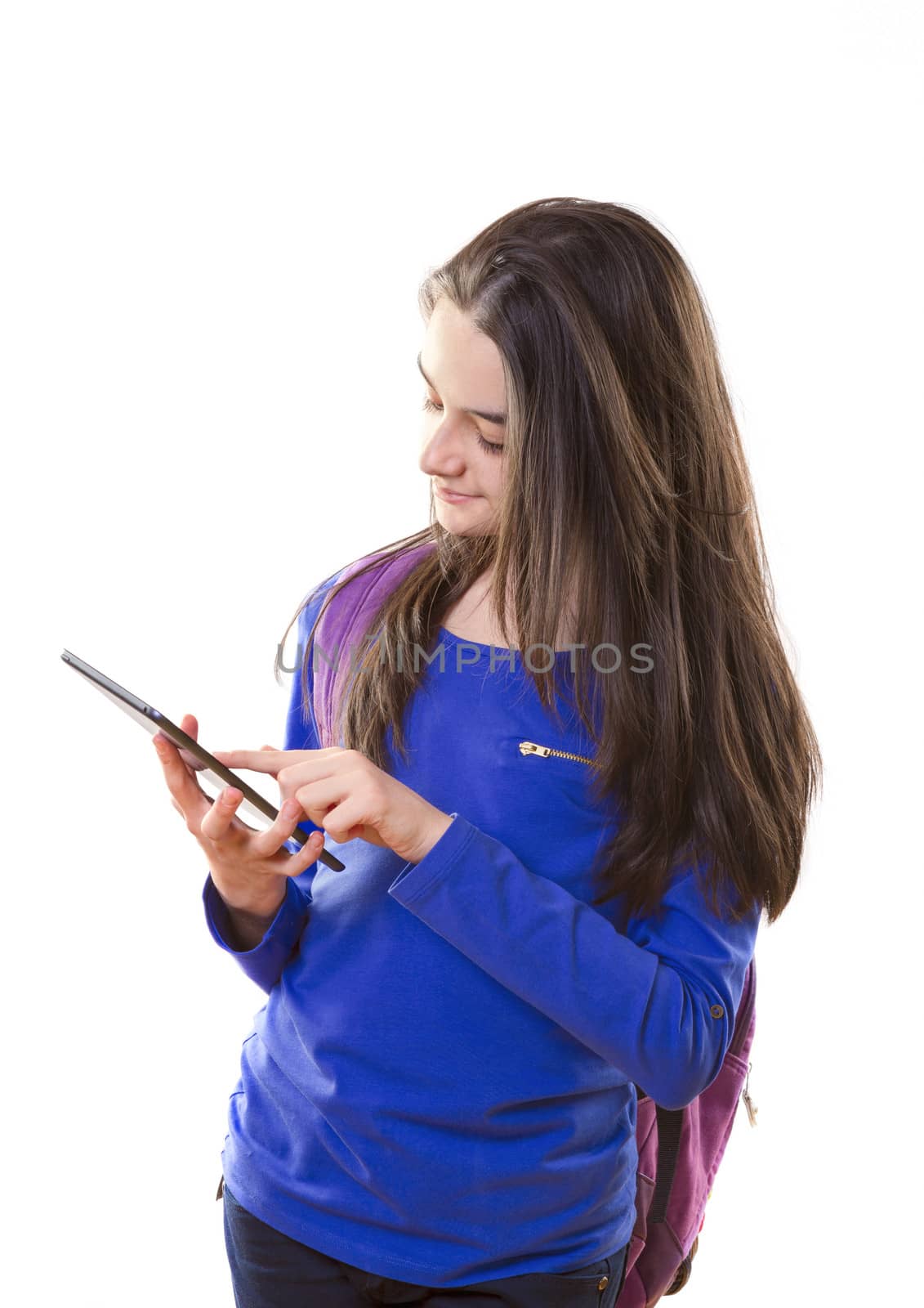 Teenager girl with backpack with digital tablet in her hands.